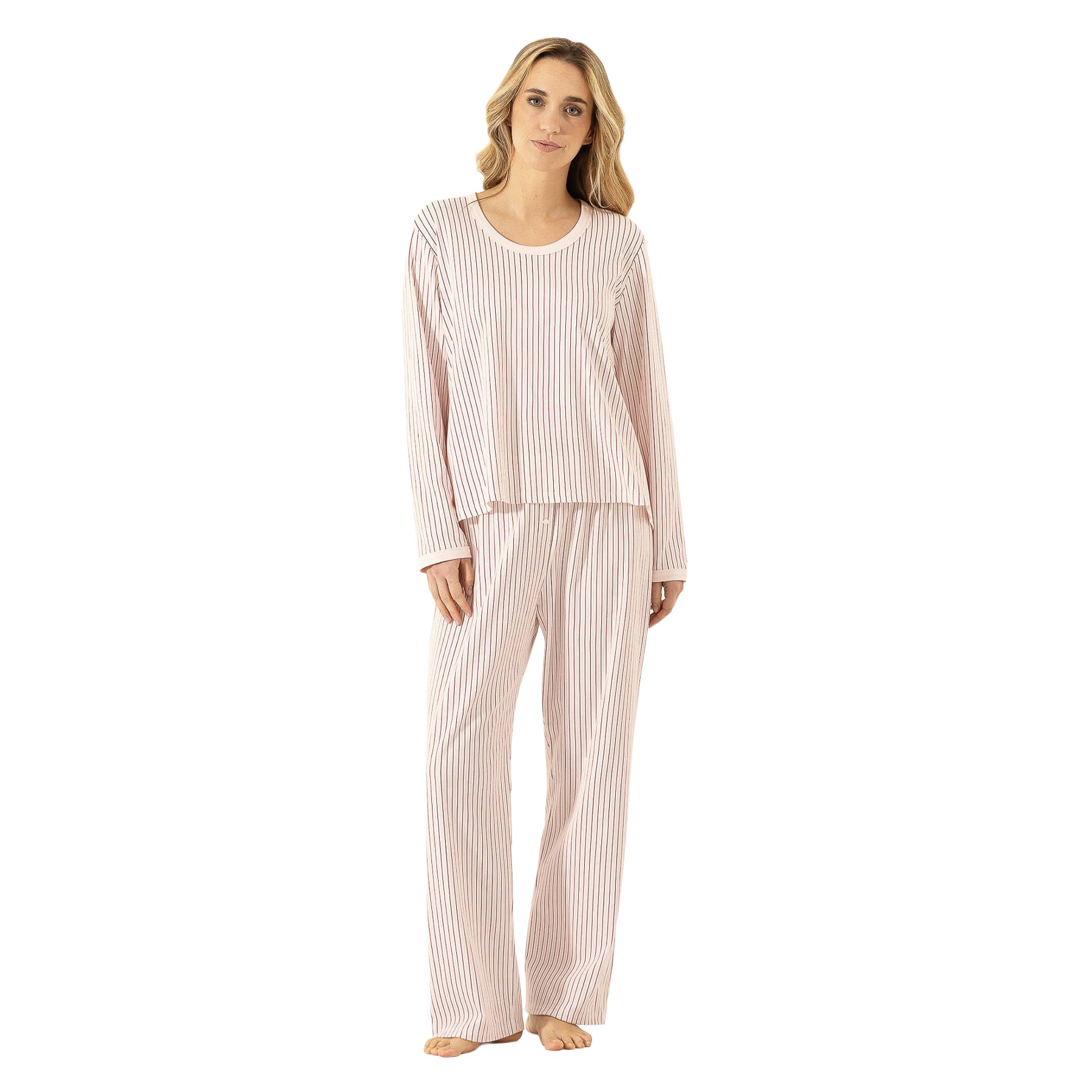 Woman wearing a soft blush pink striped long-sleeve pajama set with relaxed straight-leg pants.