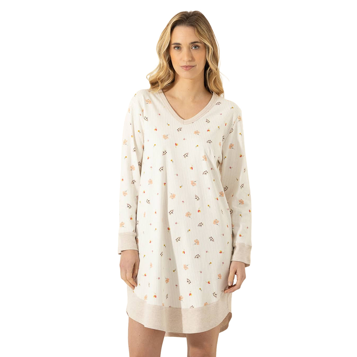 Woman wearing a cream long-sleeve sleep gown with delicate mini floral print, V-neckline, contrast cuffs, and curved hem.