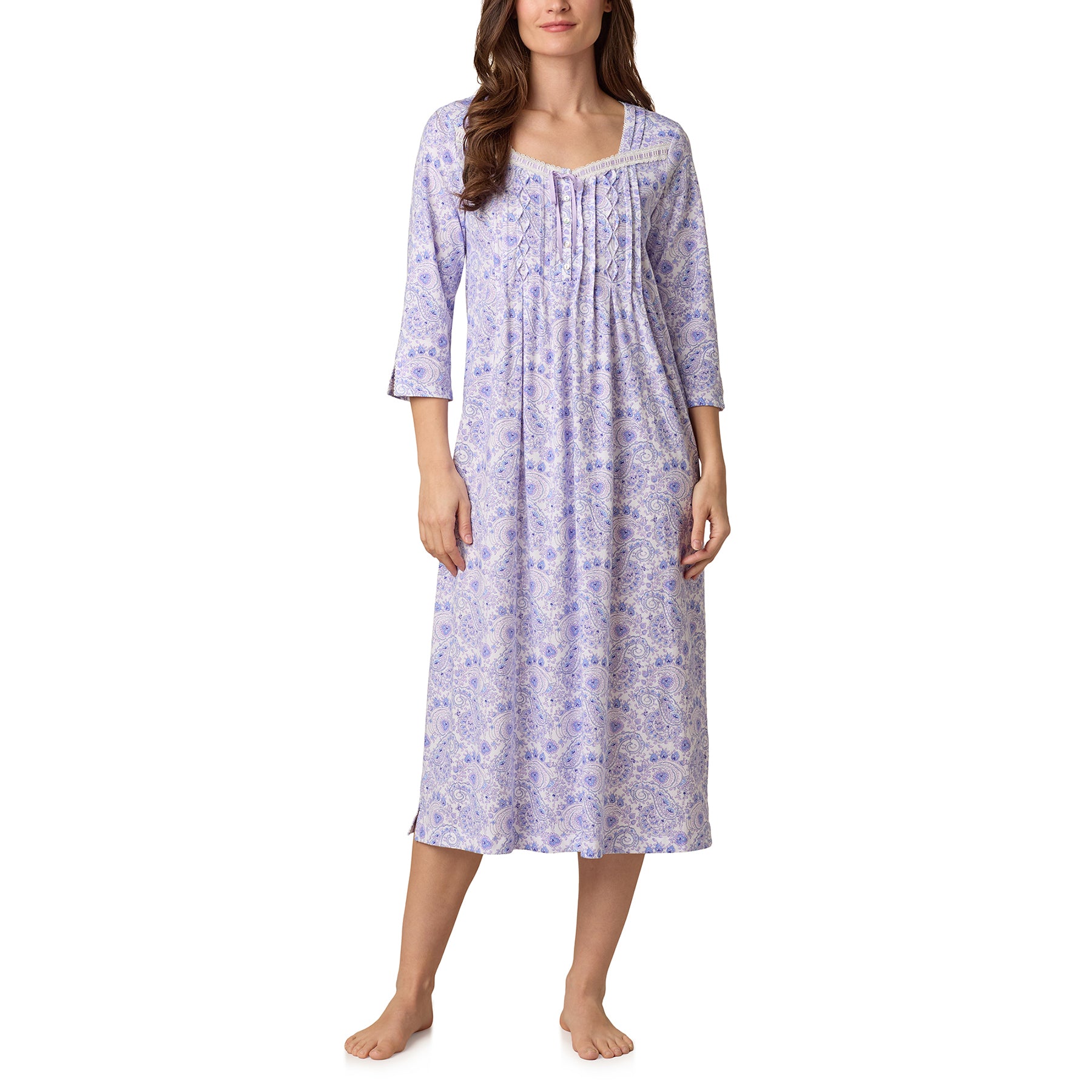 Woman wearing Carole Hochman 50-inch purple and blue paisley ballet gown with 3/4 sleeves and lace neckline.