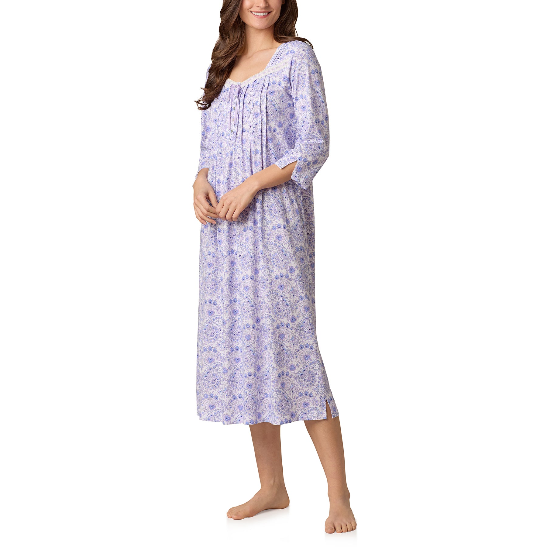 Side view of woman wearing long paisley-print cotton nightgown with relaxed fit.