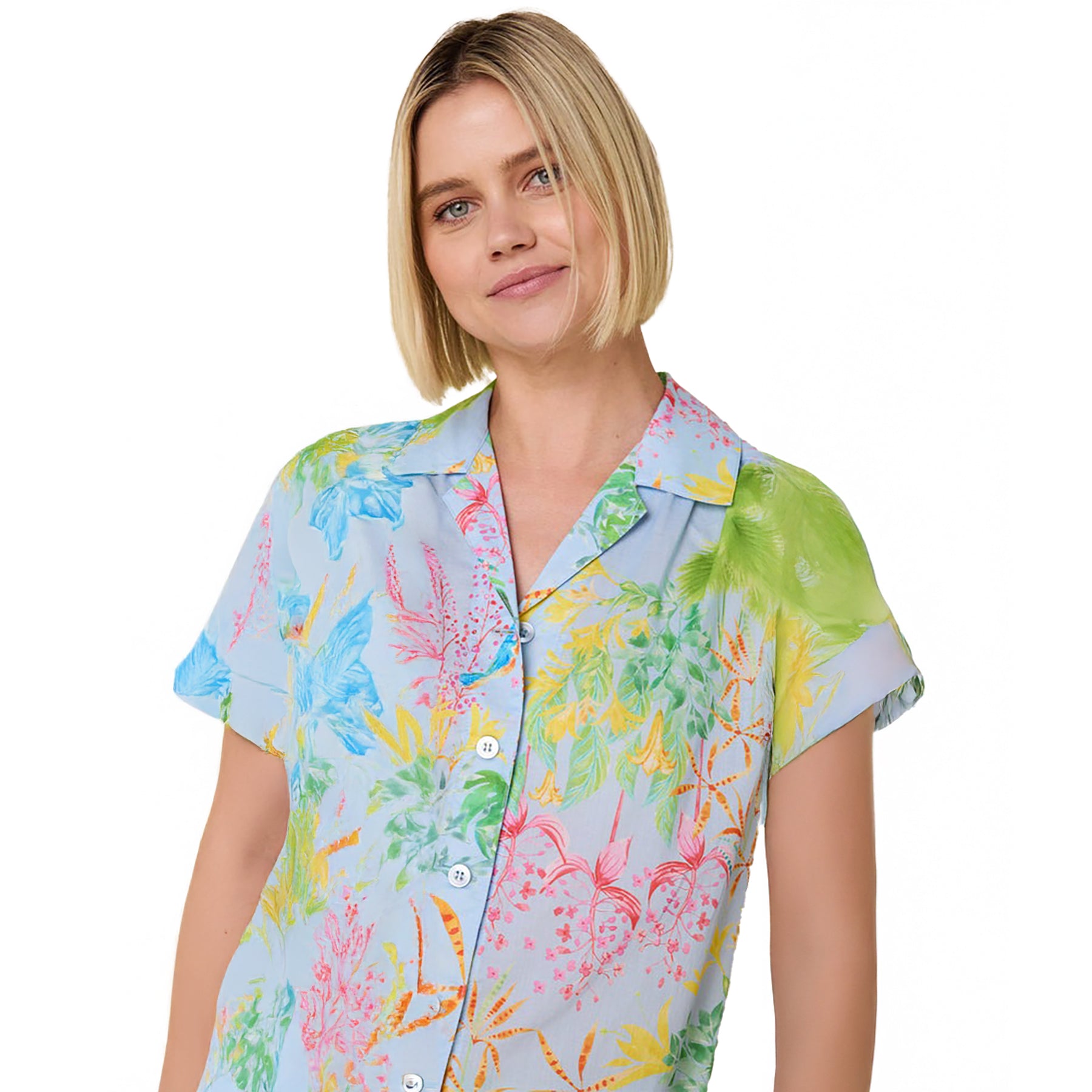 short sleeve button up pajamas with matching capri pants in a multicolour hummingbird print on a blue background. Front view on model closeup.