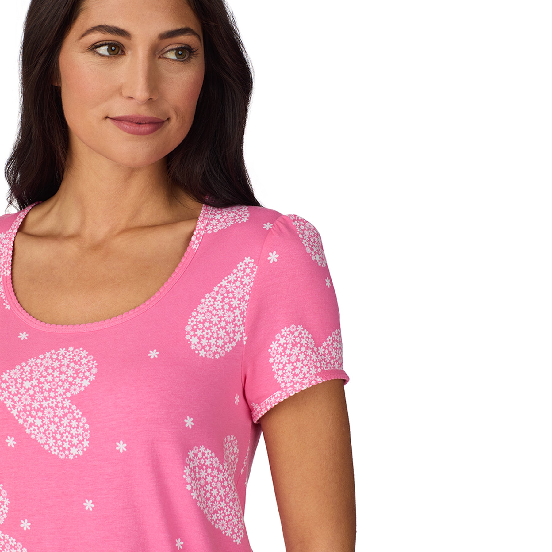 Close-up of pink pyjama top with white floral heart print and soft scoop neckline