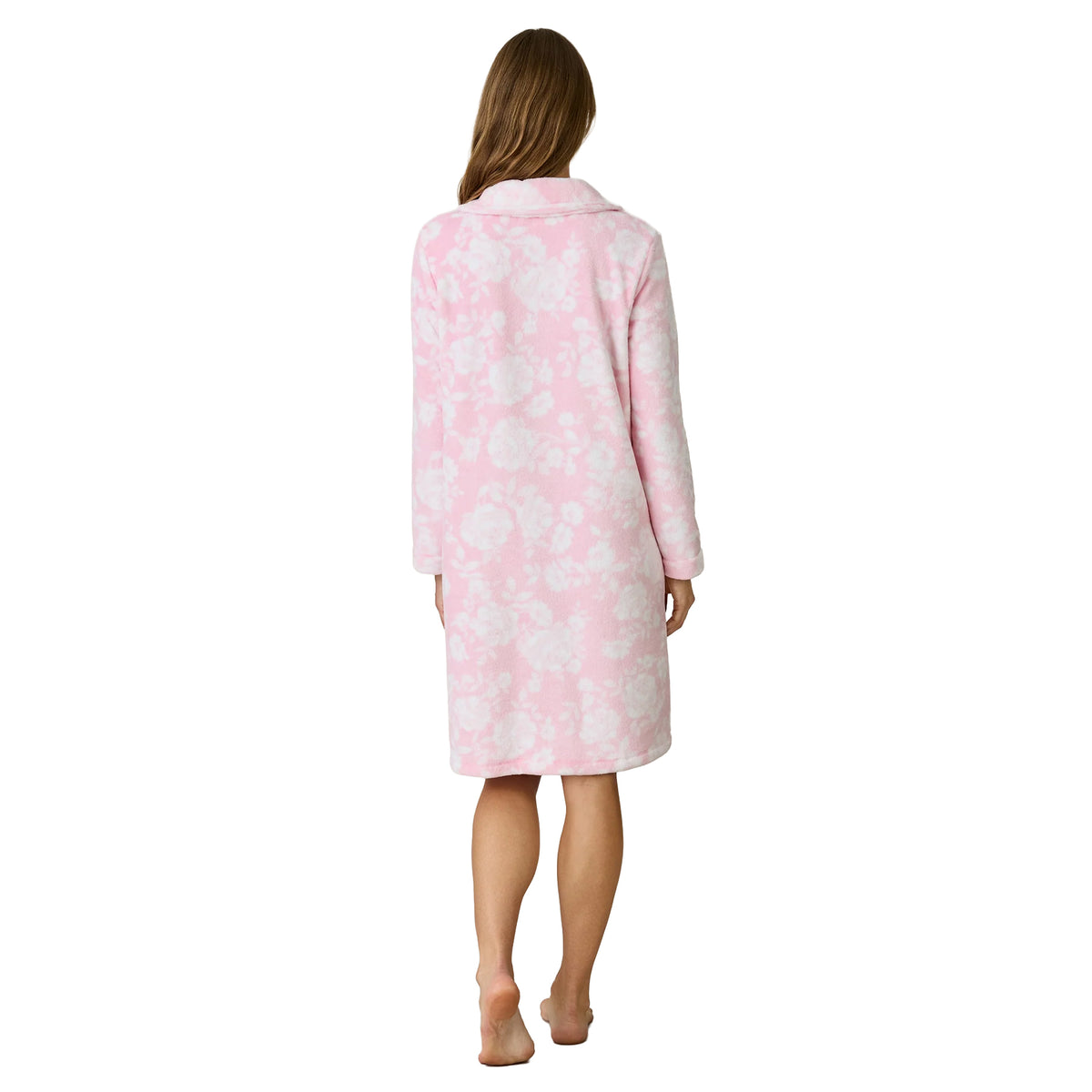Back view of a woman wearing a Carole Hochman knee-length pink fleece robe with a delicate white floral print, long sleeves and relaxed fit.