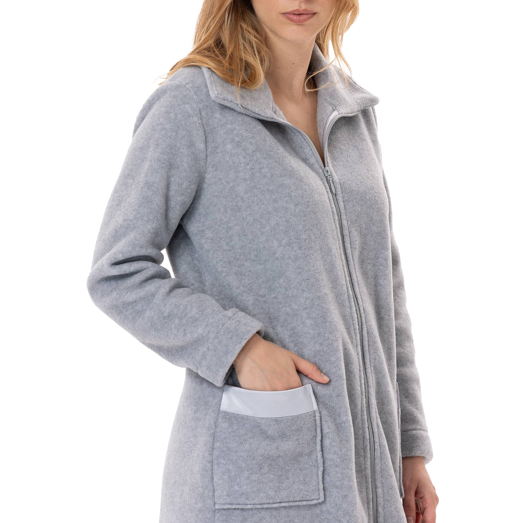 Side view of woman wearing grey fleece robe with front zipper and satin pocket detail.