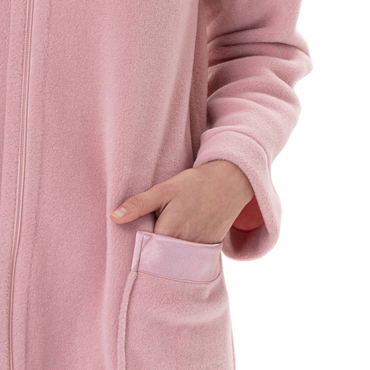 Close-up of the blush pink robe showing the soft fleece fabric and front patch pocket with tonal satin trim.