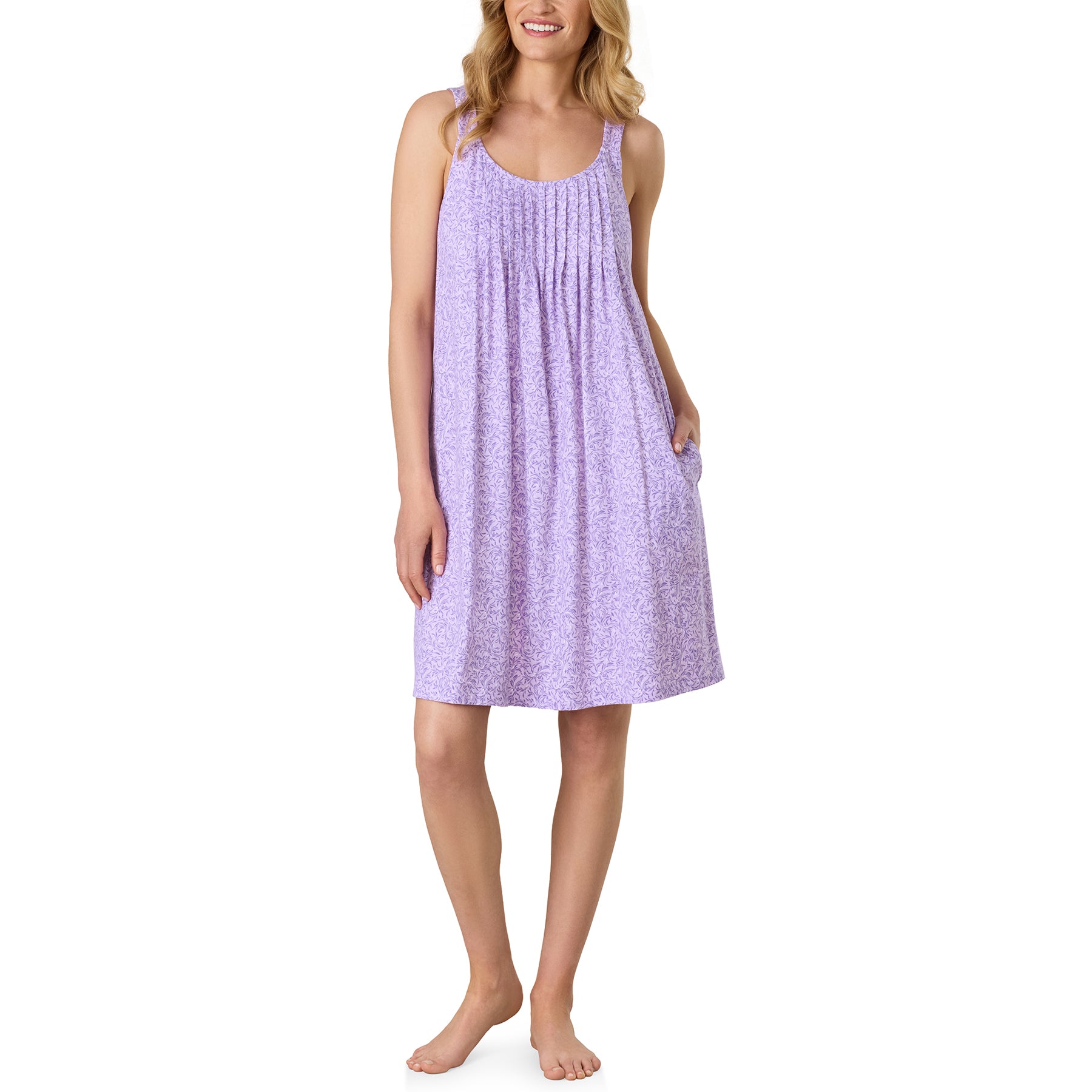 Angled front view of the Carole Hochman sleeveless chemise featuring a soft floral print, flattering gathered bodice, and convenient side pockets.