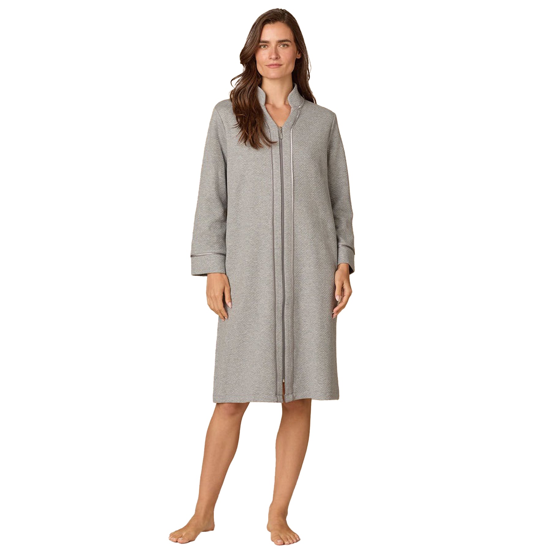 Woman wearing a gray hooded robe on a white background