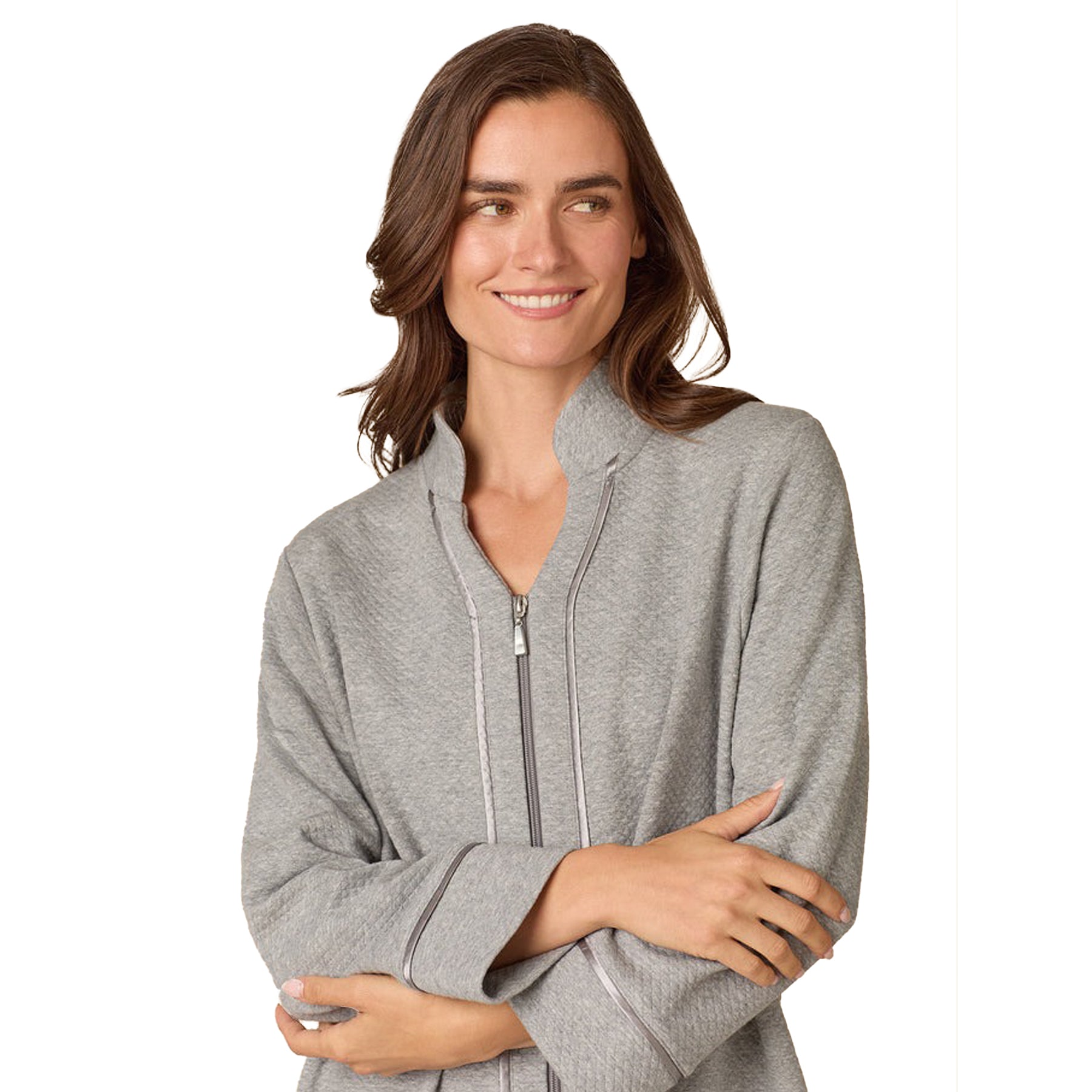 Woman wearing a gray zip-up hoodie on a white background