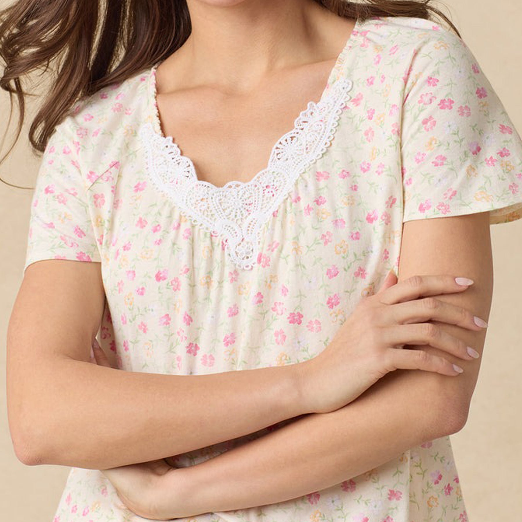 Close-up of floral pajama top with scalloped white lace at the neckline.