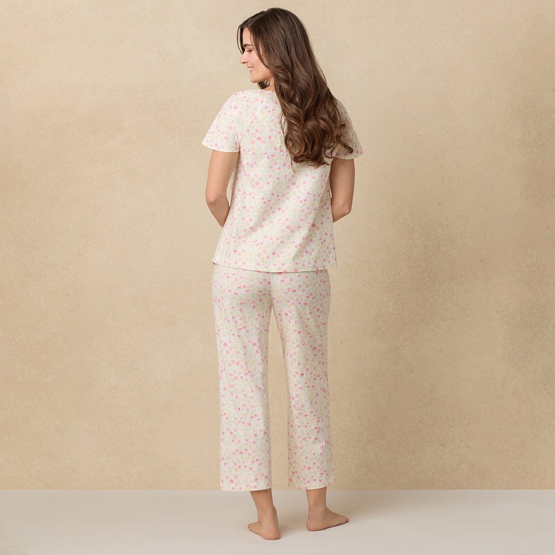 Back view of the full-length floral pajama set showing short sleeves and wide-leg pants.