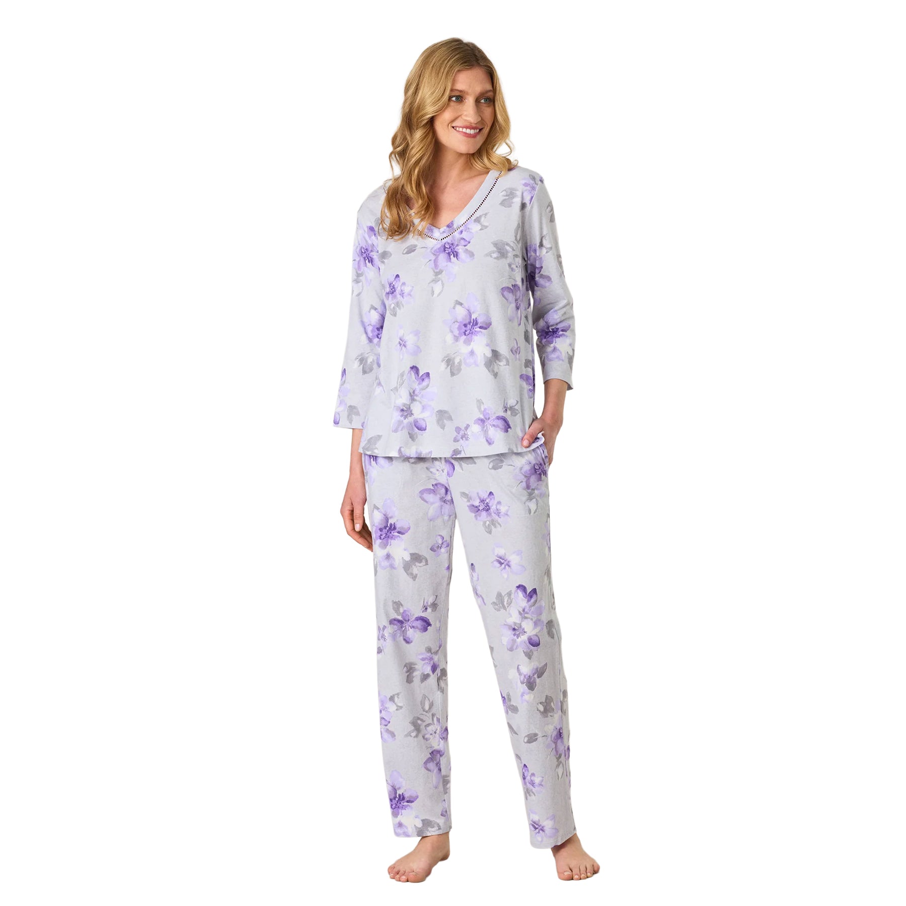 Women’s grey floral pajama set featuring a V-neck three-quarter sleeve top and matching straight-leg pants with purple flowers.
