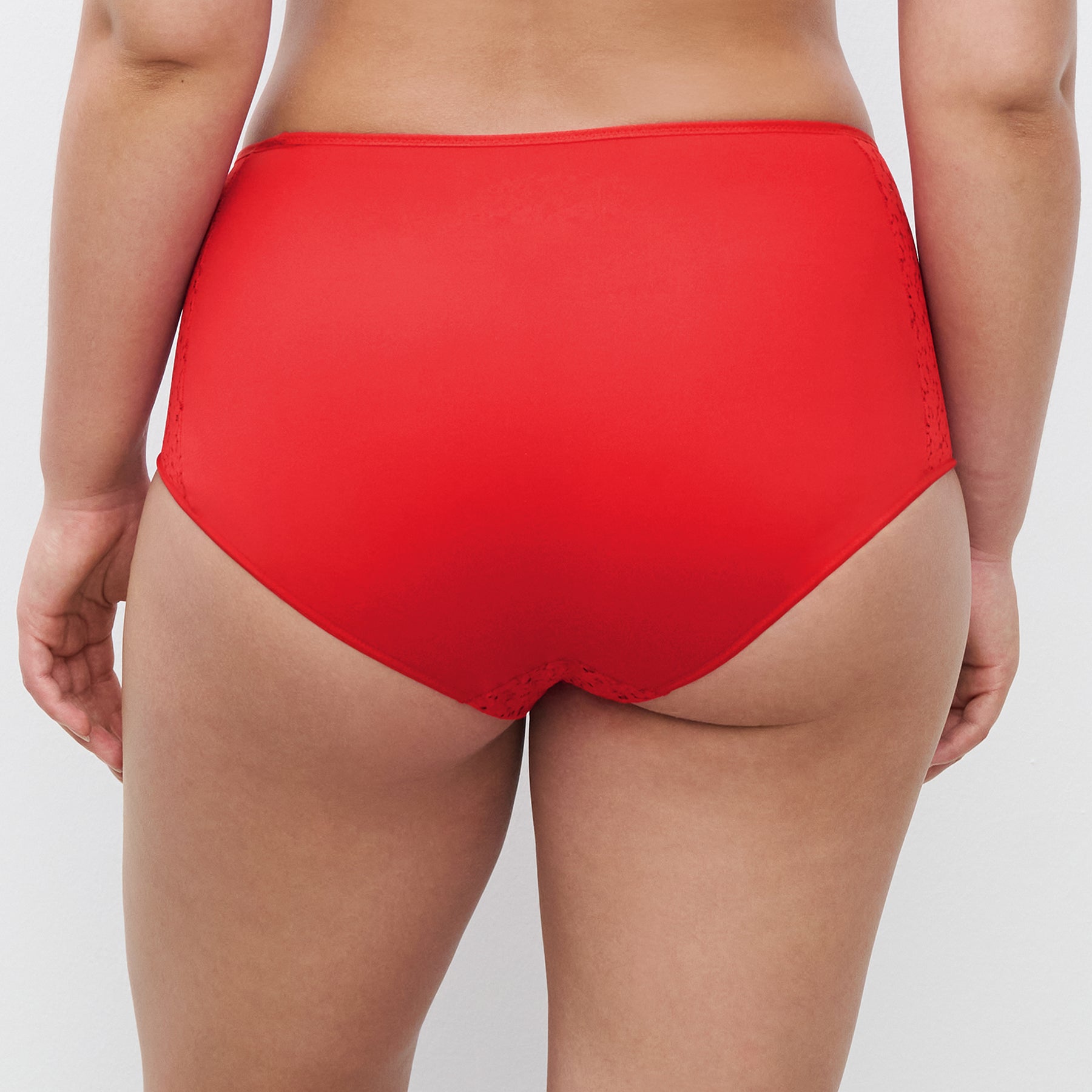 Chantelle light control Norah full brief C13F3 with floral lace in poppy red 0YU. Rear view on model.