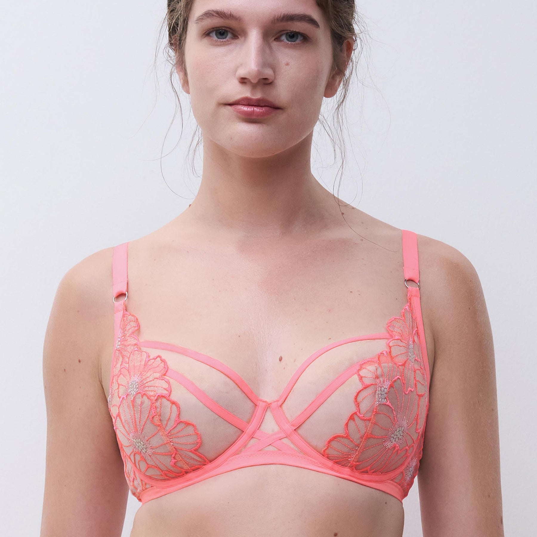 Full cup unlined bra in rose miami bubblegum pink in sheer tulle with daisy embroidery. Front view closeup on model 2.