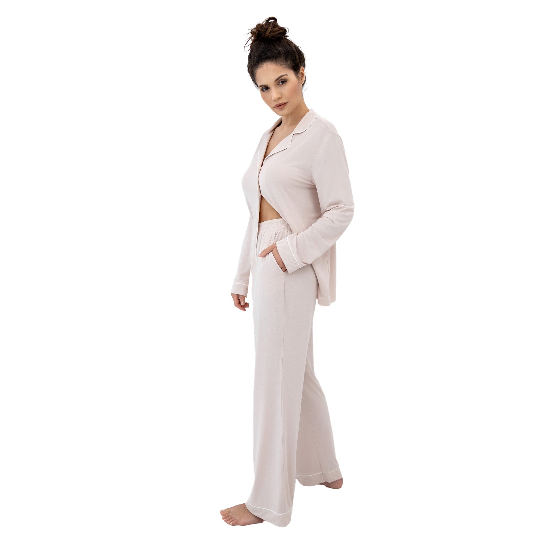 Side view of sand beige pyjama set with long sleeve top and wide-leg pants, minimal elegant lounge look
