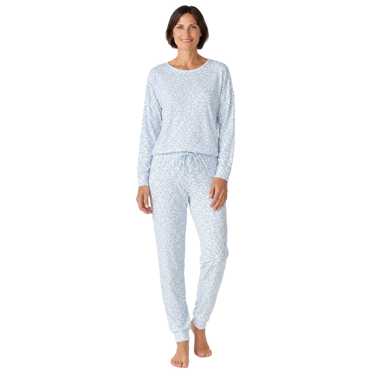 Model wearing a light blue leopard print pajama set featuring a crew-neck long-sleeve top and matching drawstring jogger pants, front view.