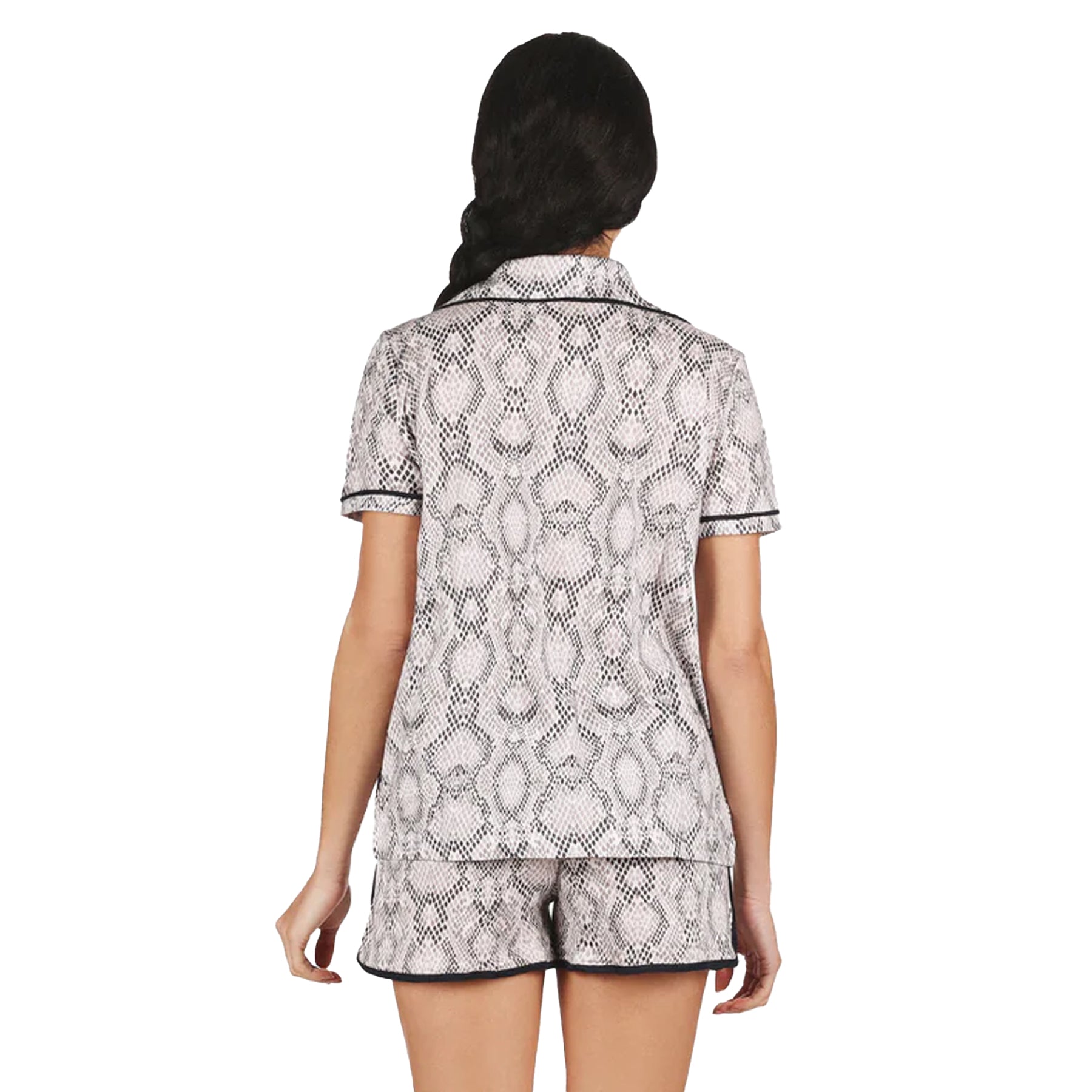Back view of snake print pyjama set with loose-fitting top and matching shorts featuring contrast trim.