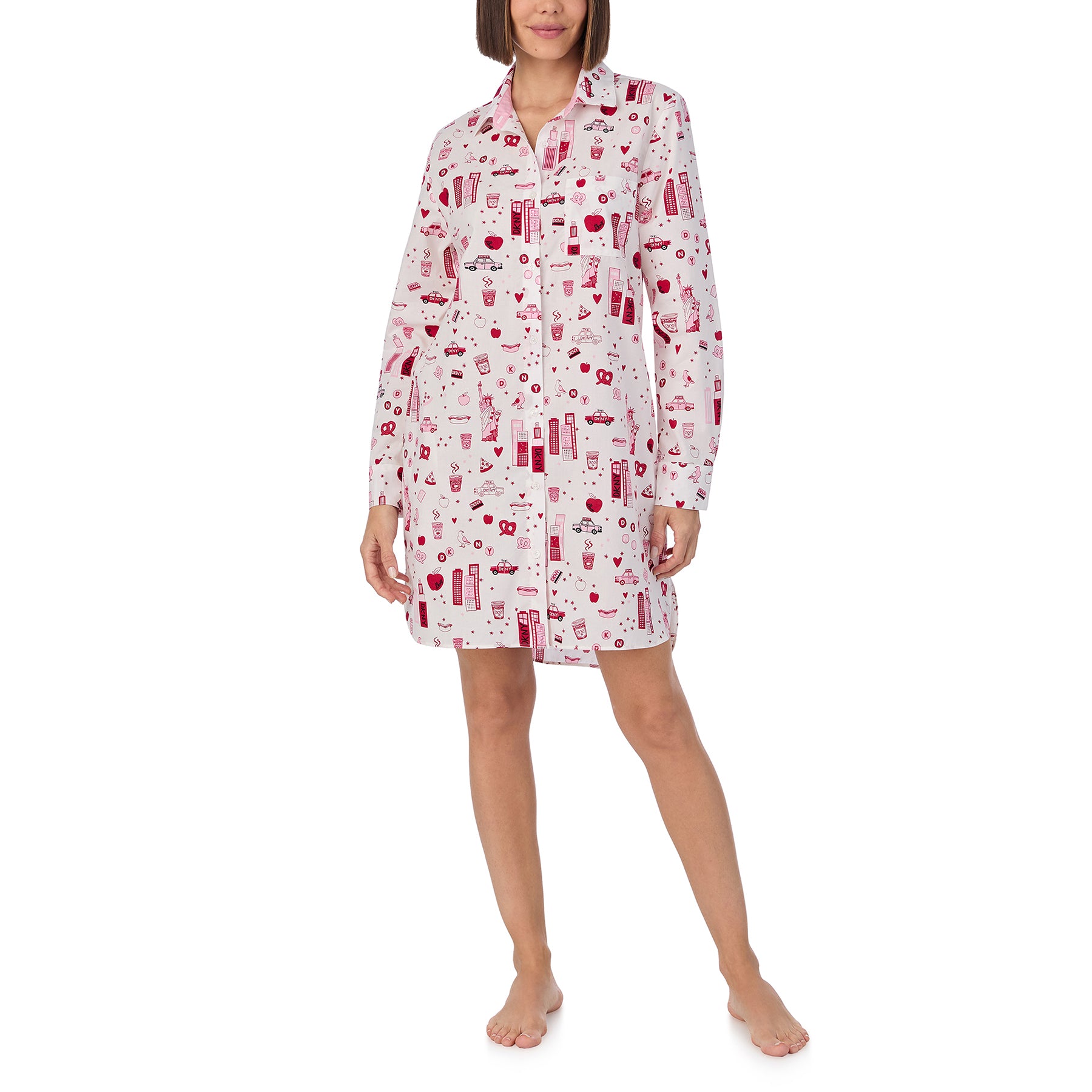 Long sleeve collared button up sleepshirt printed with new york city items in red and pink on a white background. Front view on model.