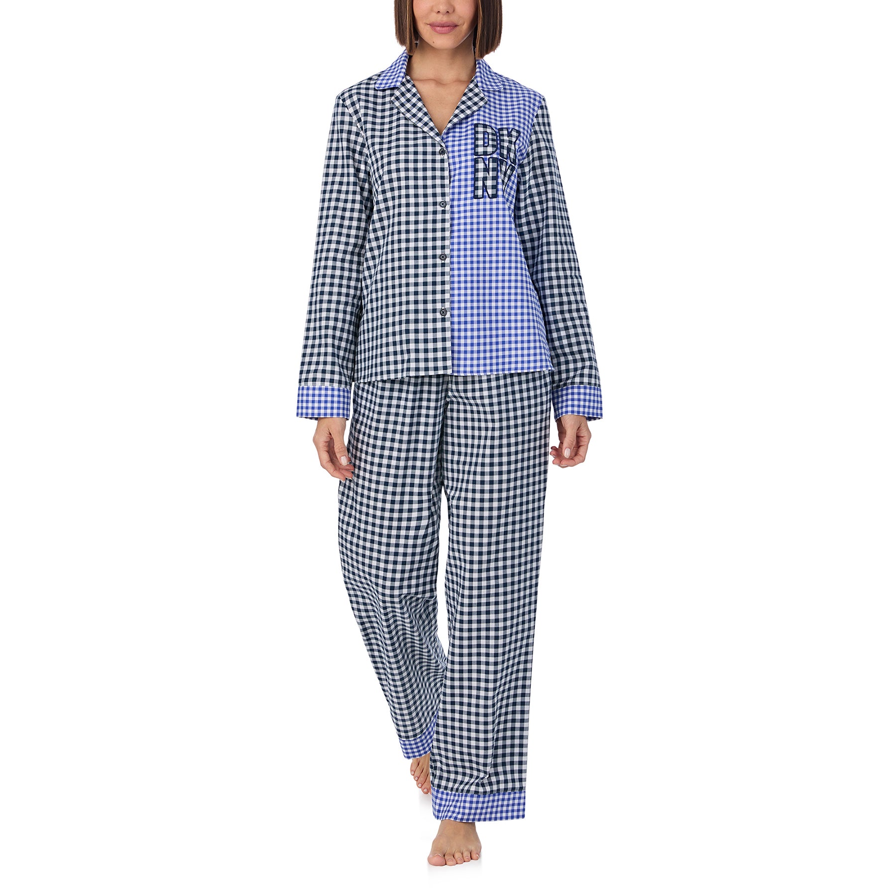 Classic 2-piece button up pyjama set in blue and black checkered gingham print. Front view on model.