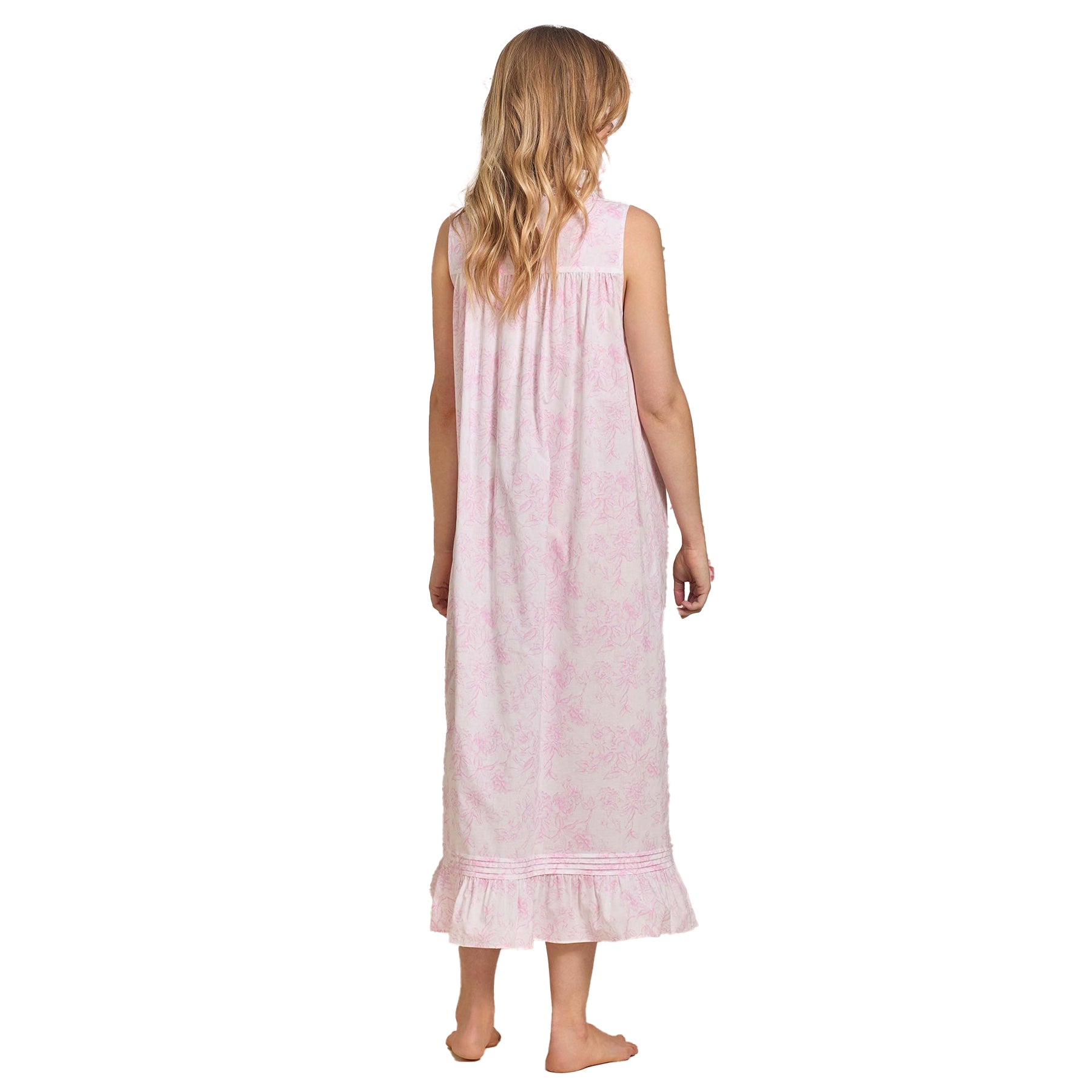 Back view of a long cotton nightgown with light pink floral print and ruffled hem.