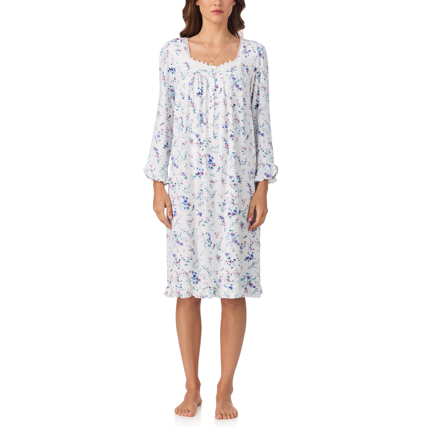 Woman wearing a floral nightgown on a white background