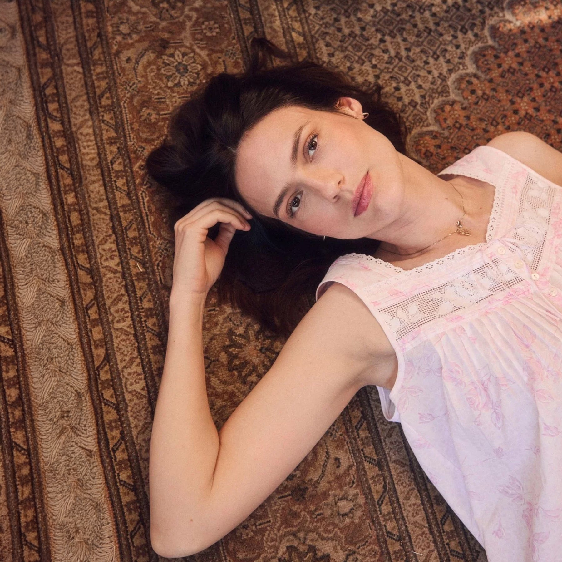 Lifestyle close-up of Eileen West pink floral chemise featuring lace yoke detailing and soft feminine fabric drape.
