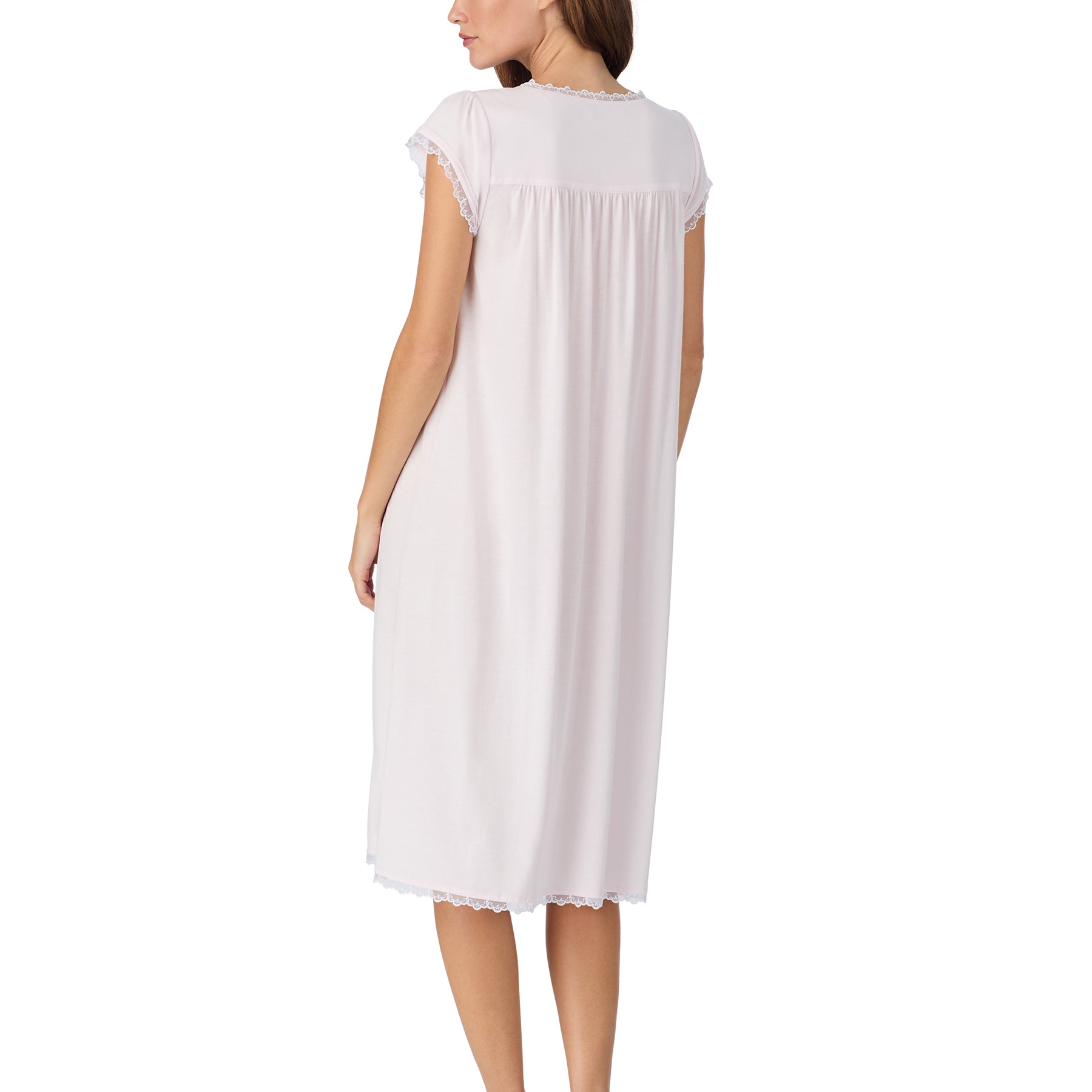 Soft pink short-sleeve nightgown shown from the back with a flowing silhouette, gathered yoke, and delicate lace trim along the neckline and sleeves.