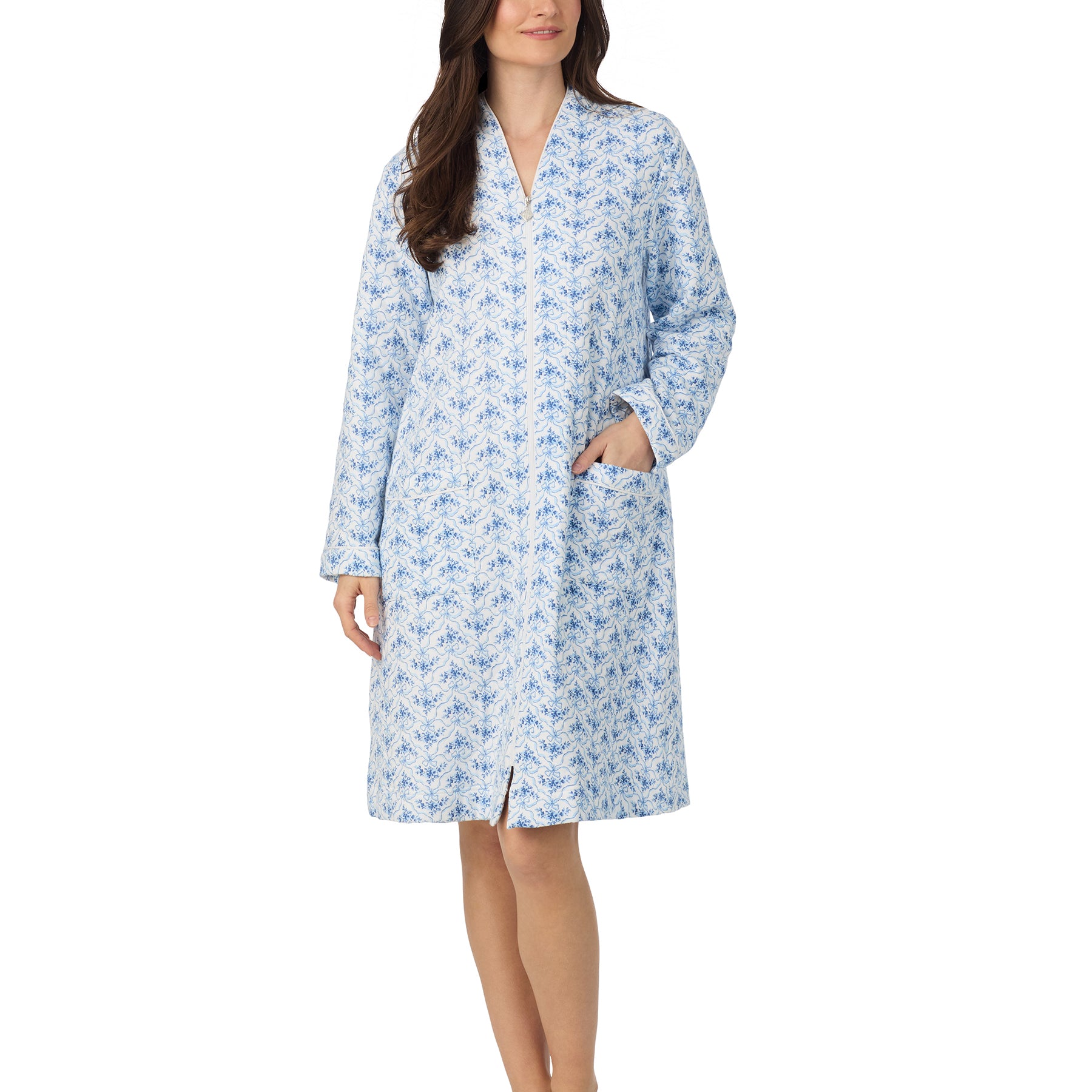 Woman wearing Eileen West blue floral cotton zip robe with front pockets and a mid-length cut.
