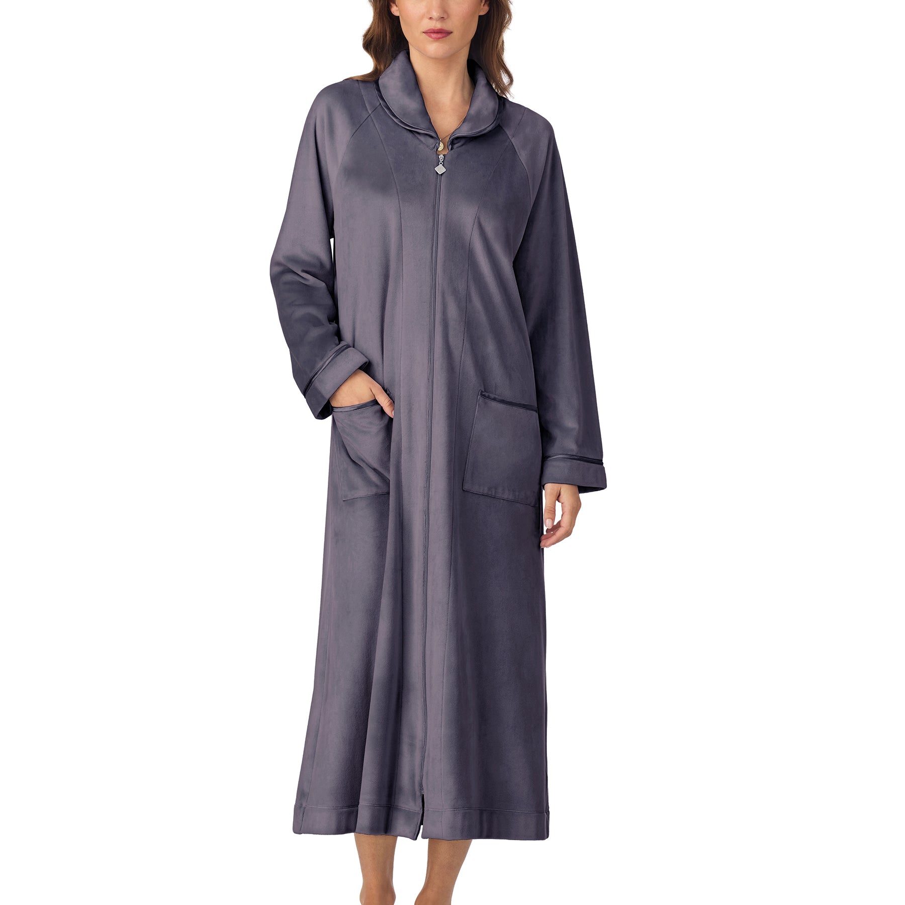 Woman wearing long charcoal robe with front zipper and relaxed fit, one hand in pocket.