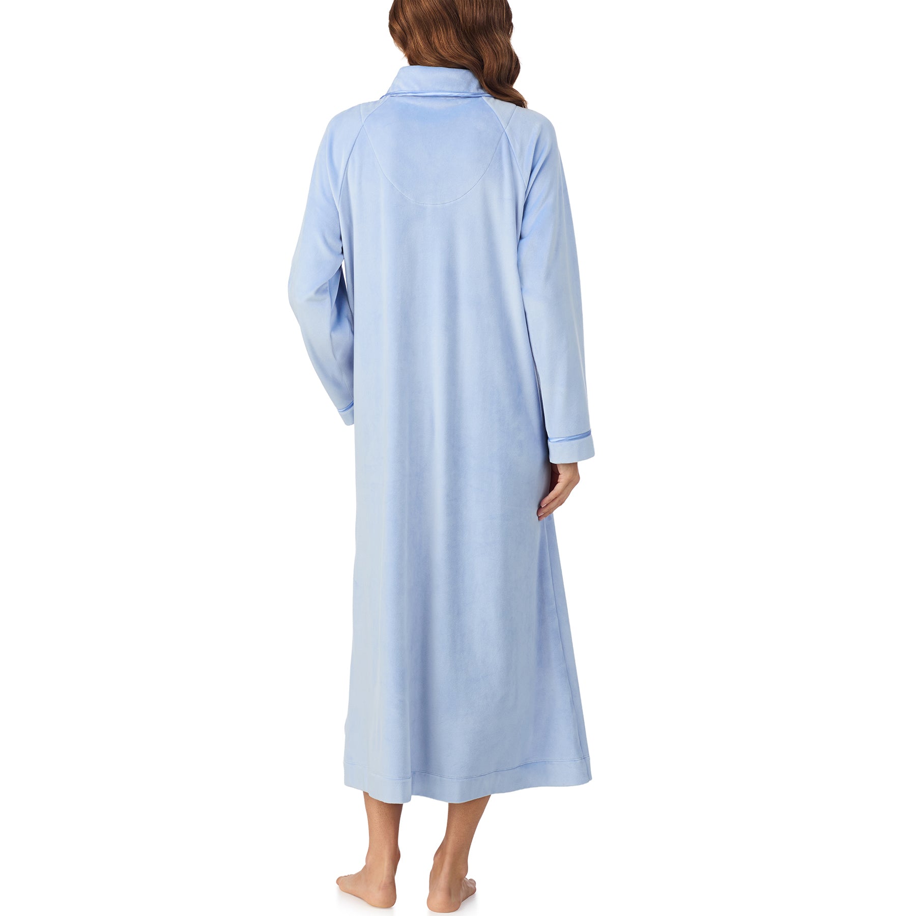 Back view of woman wearing long periwinkle blue velour robe with collar and cuffed sleeves.