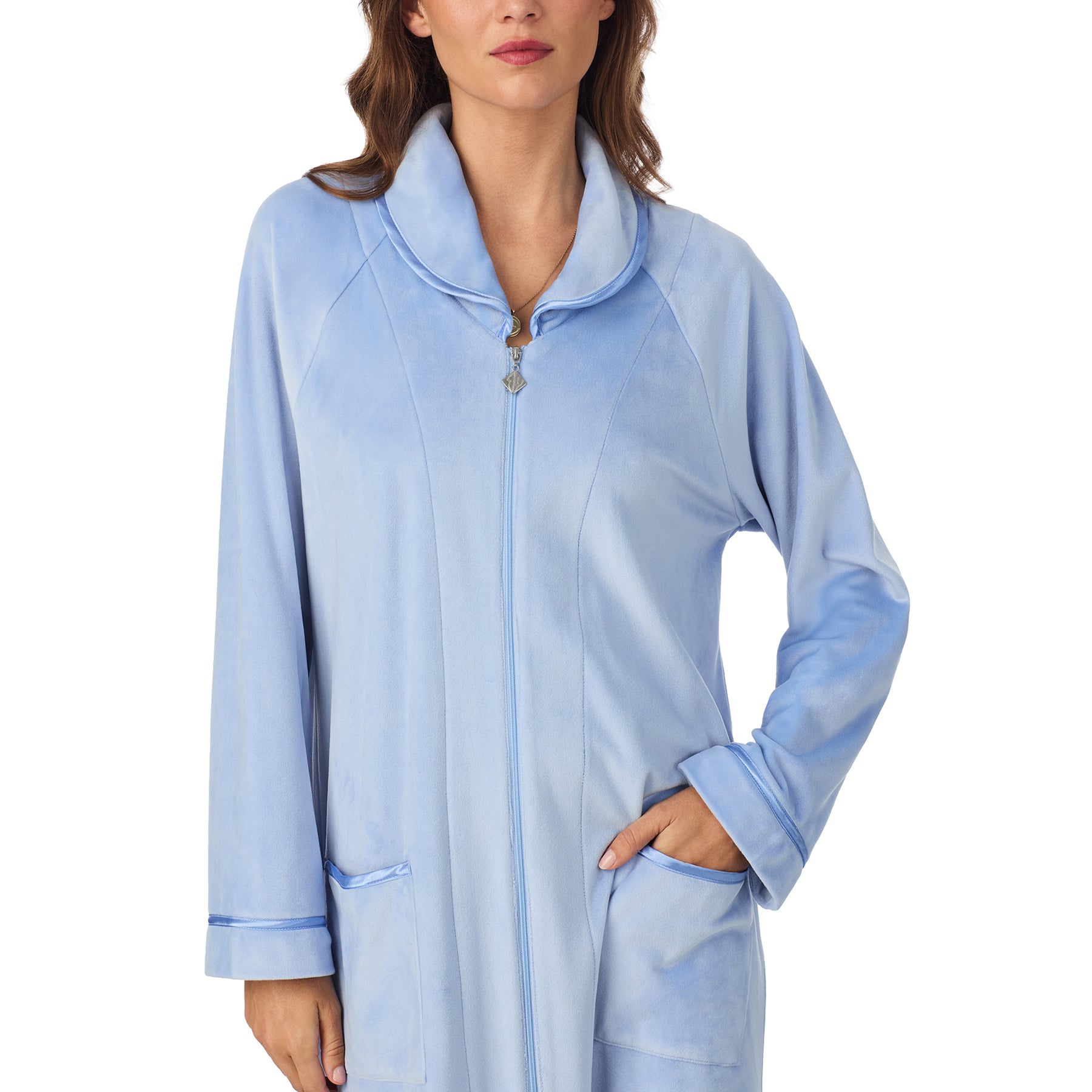 Close-up of periwinkle velour robe showing collar, zipper, and pocket trim details.