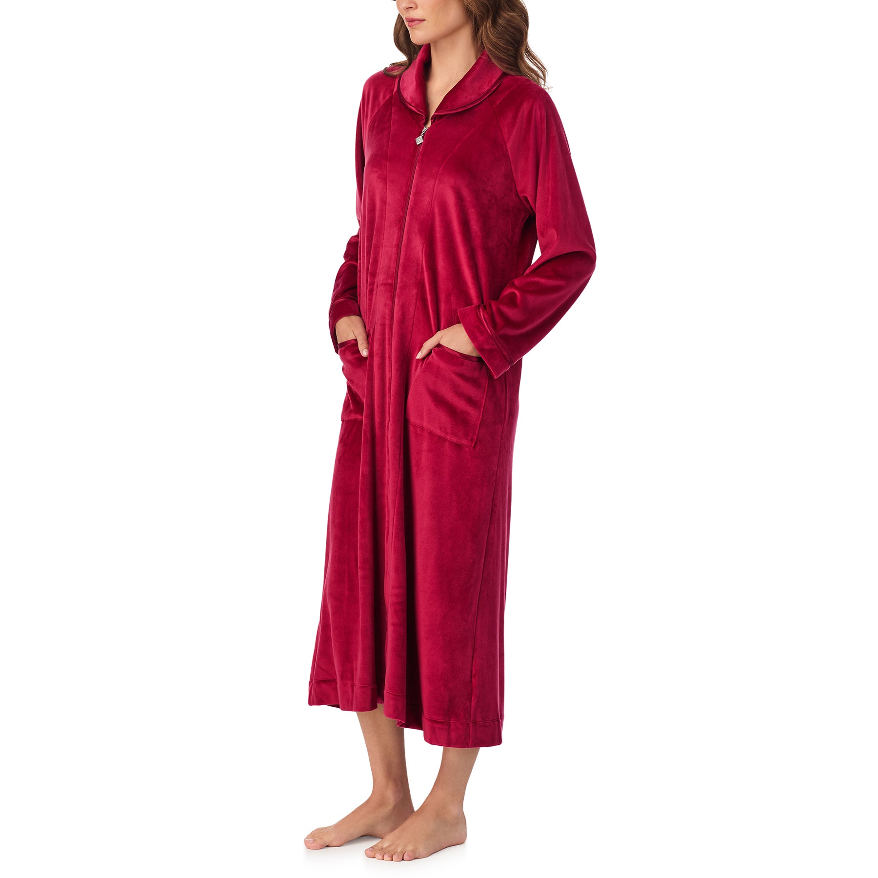 Side view of woman wearing long wine red zip-front robe with soft velour texture.