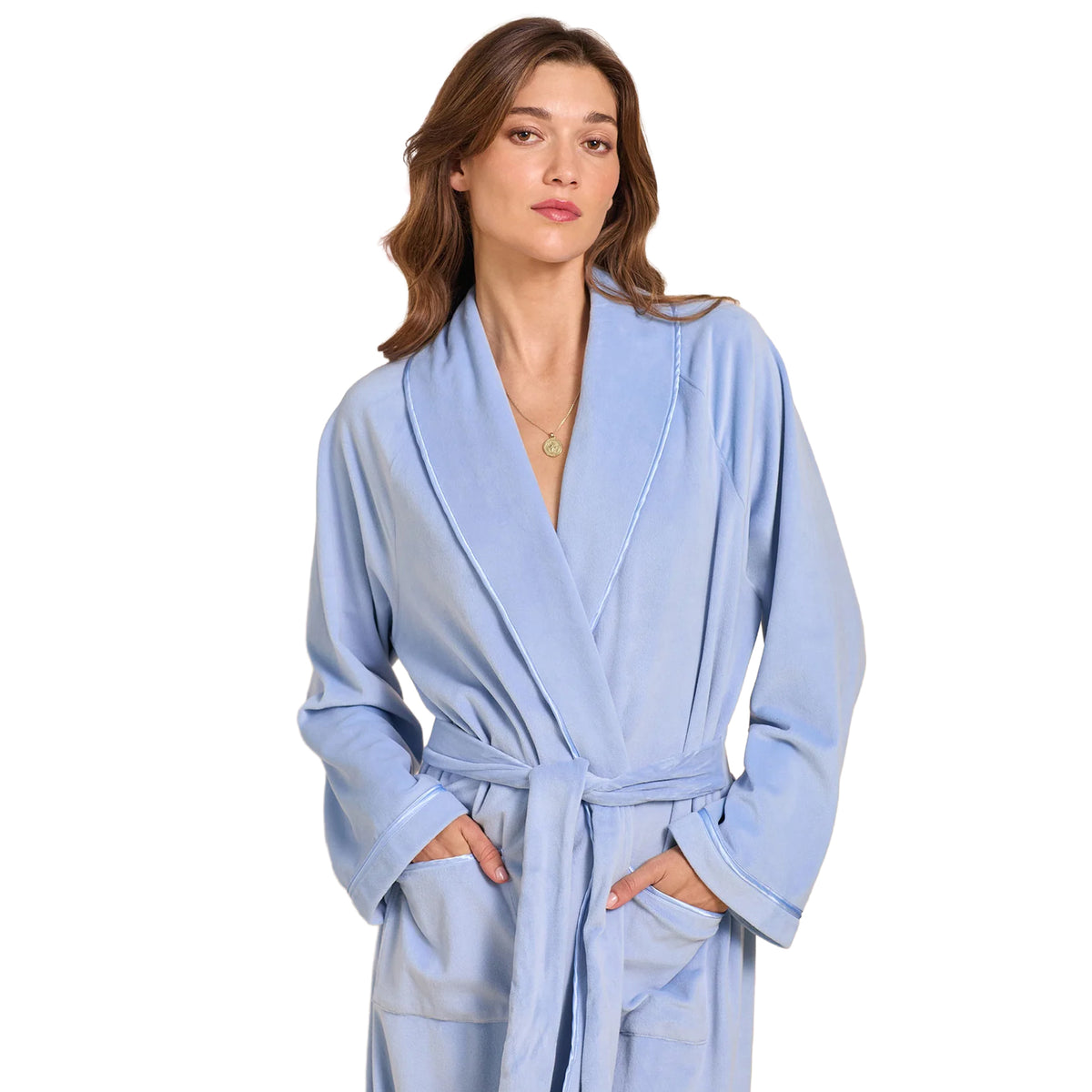 Close-up of a light blue wrap robe featuring a soft shawl collar, matching waist belt, front pockets, and delicate piping along the edges.
