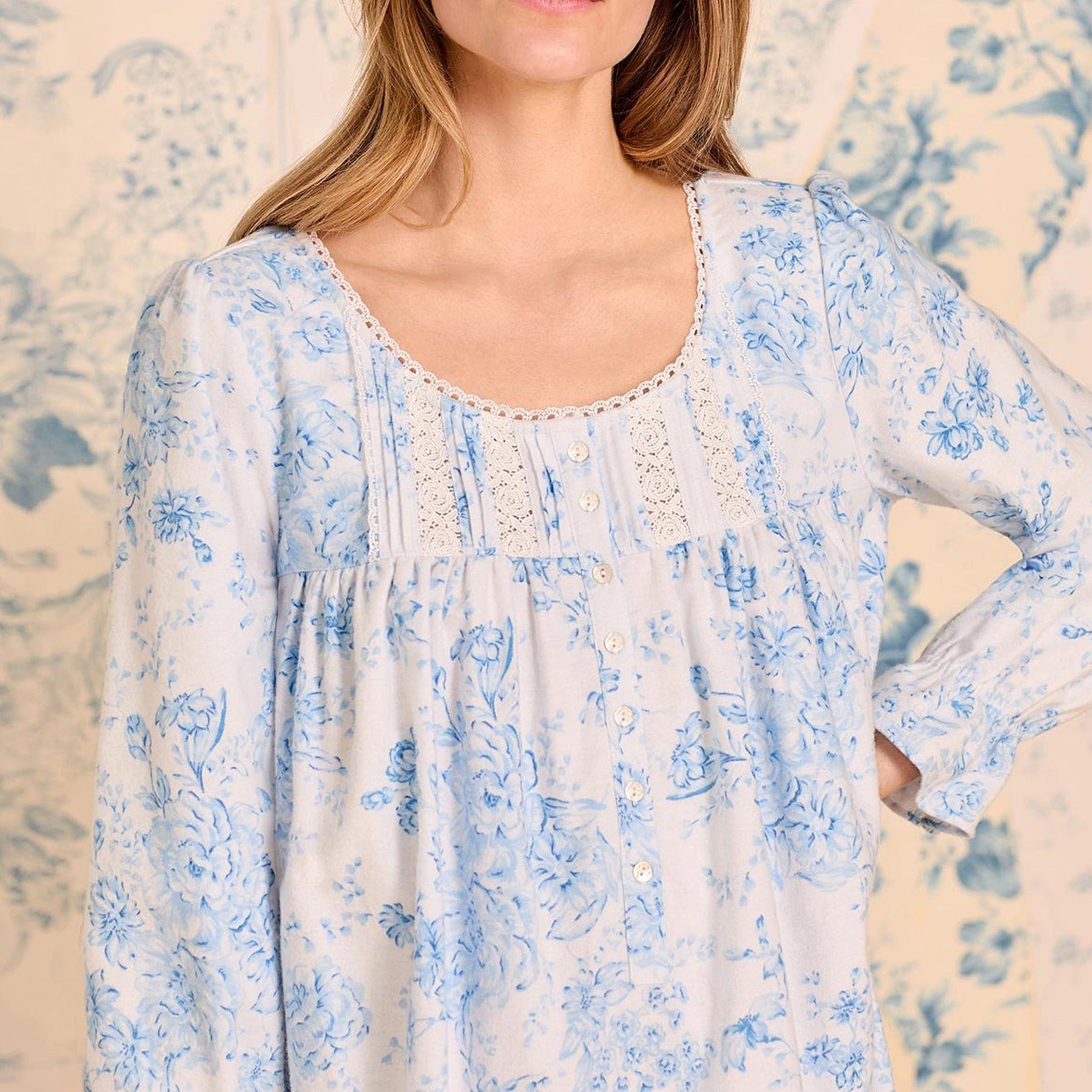 Close-up of lace-trim neckline and button placket on blue floral nightgown by Eileen West.