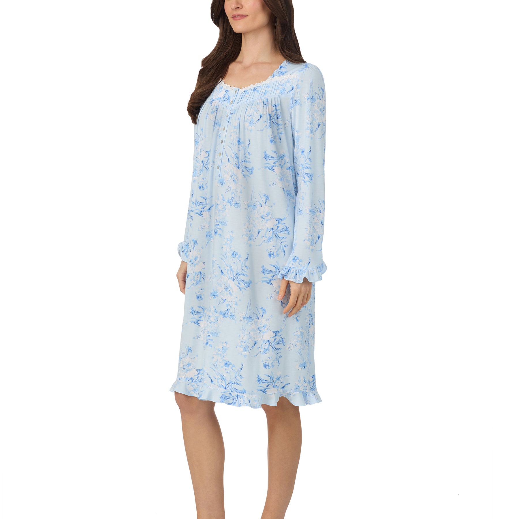Side view of a woman in a soft blue floral nightgown featuring delicate lace neckline and relaxed fit.