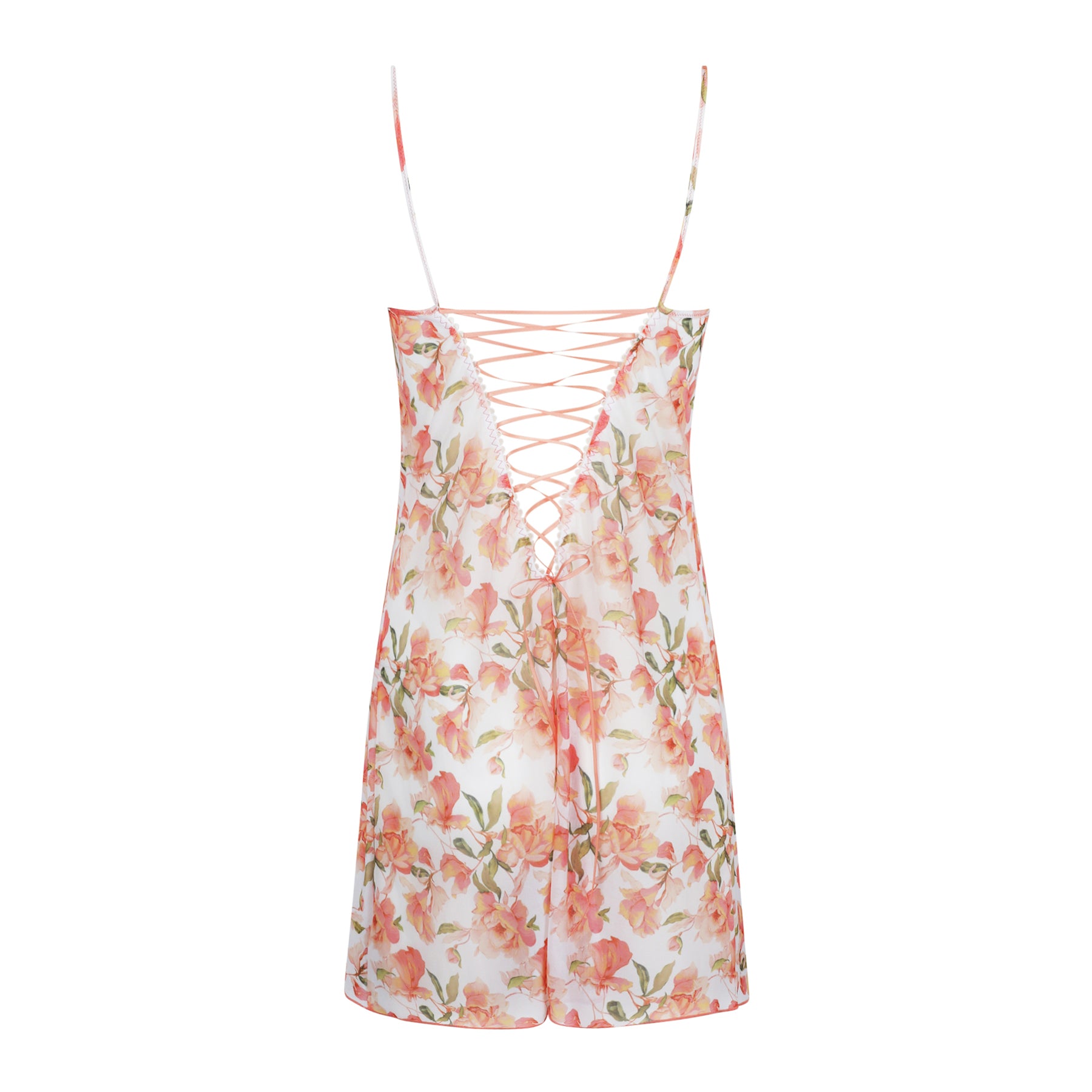 Back view of floral chemise with lace-up detail and adjustable spaghetti straps in soft peach and blush tones
