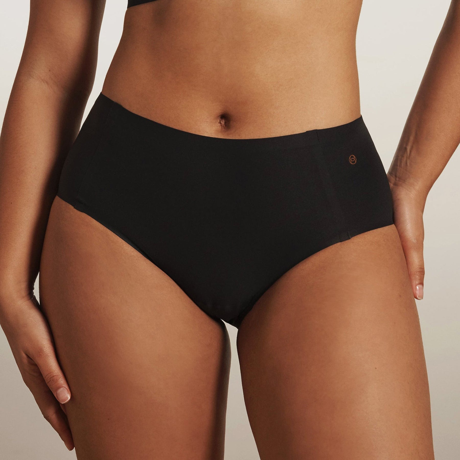 High waist seamless retro full brief underwear in black – Evelyn & Bobbie front view on model