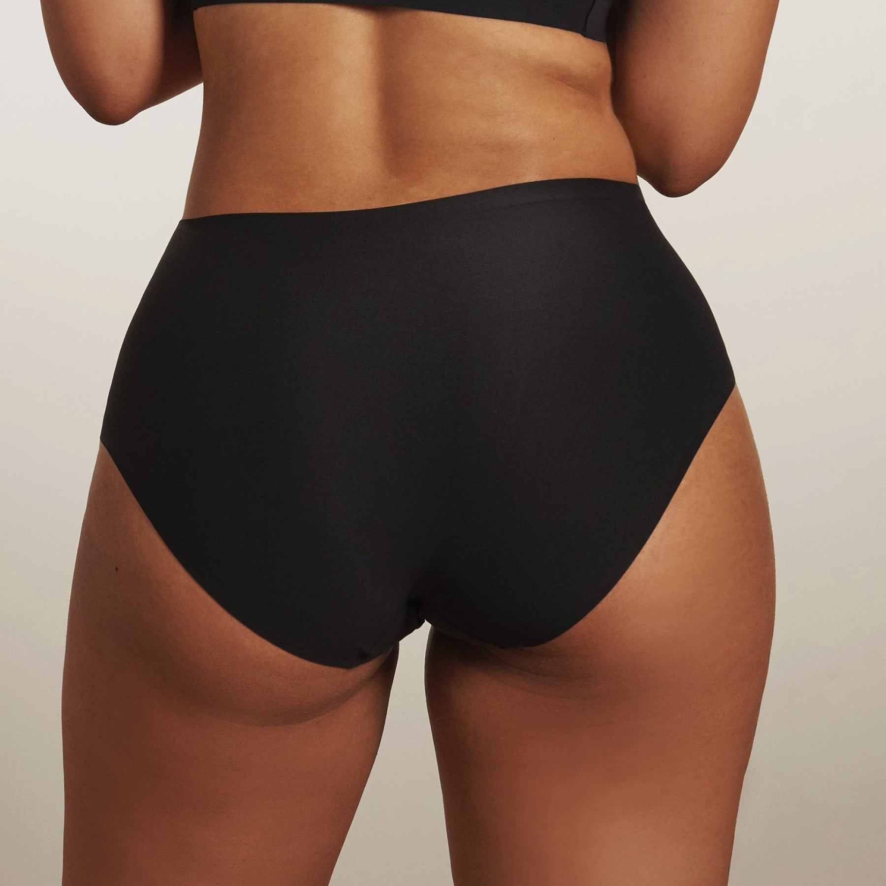 Back view of Evelyn & Bobbie black high waist smoothing full coverage underwear