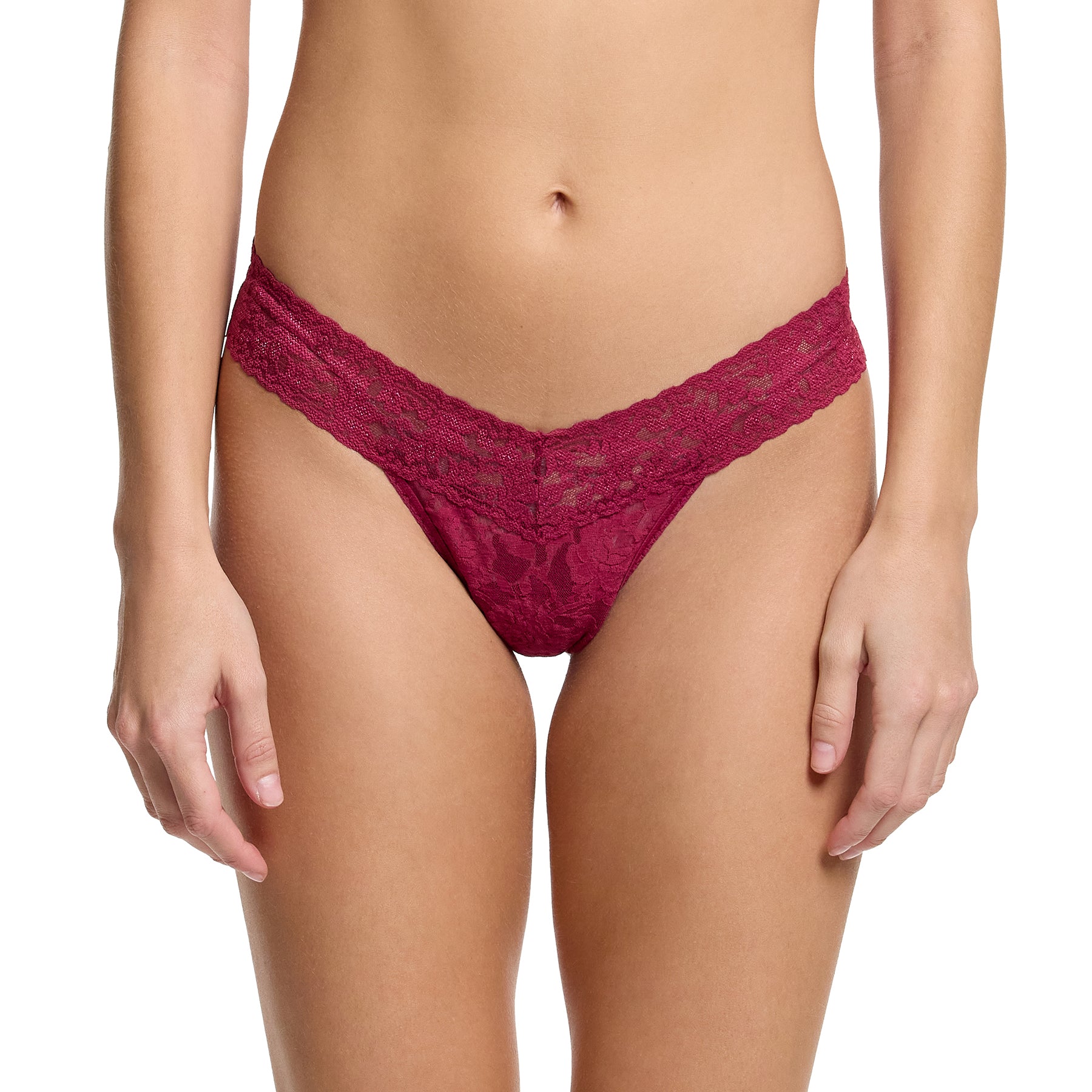 Woman wearing Hanky Panky Low Rise Thong in Merlot – soft stretch lace in dark red with low-rise fit and scalloped floral trim.