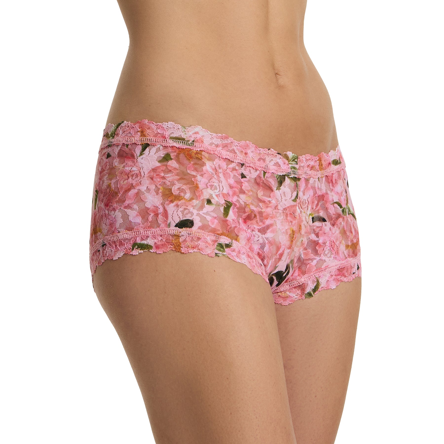 Side view of model wearing pink floral lace boyshort in the Dancing Petals print with scalloped trim and soft stretch lace