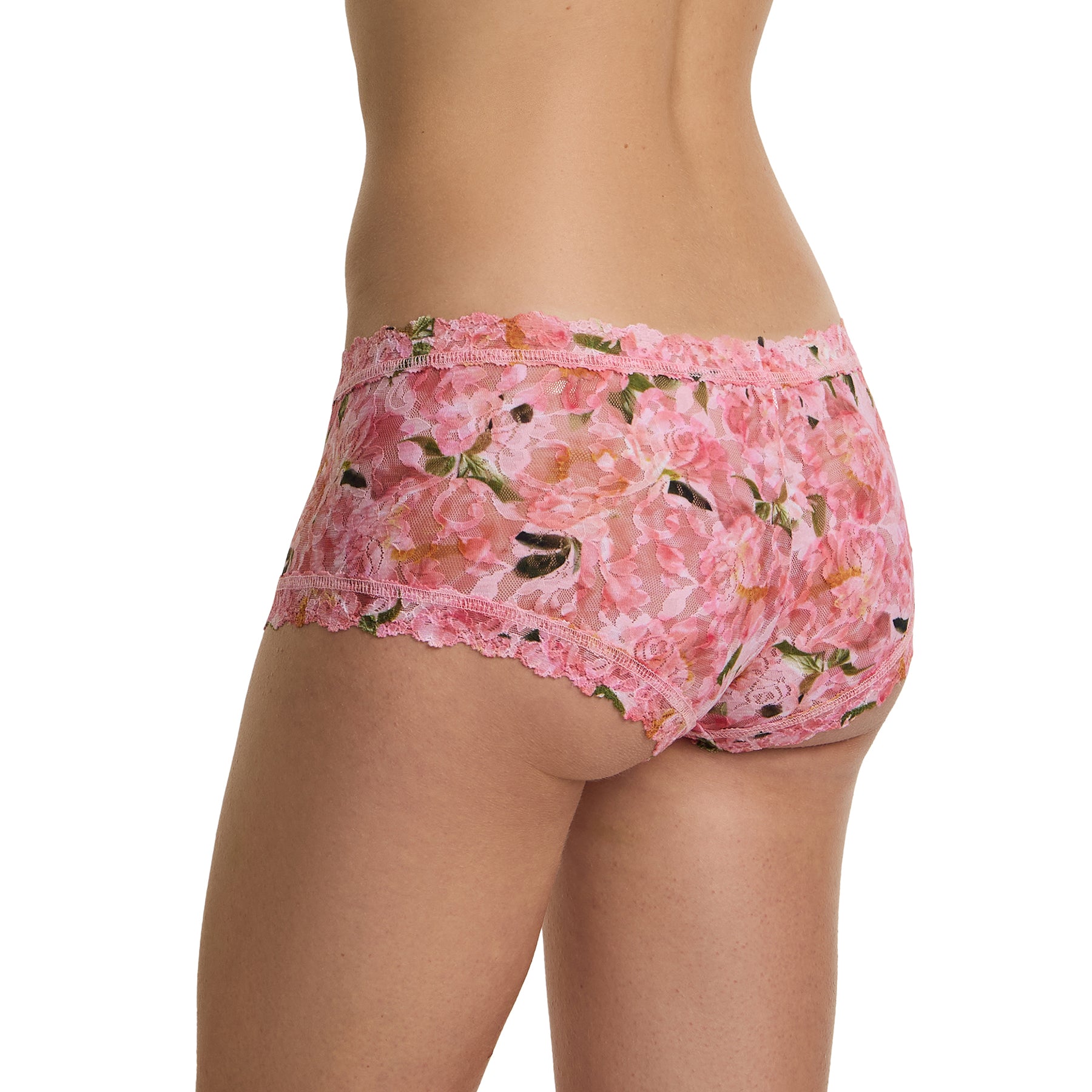 Back angle of model wearing pink floral lace boyshort in the Dancing Petals print with soft scalloped lace and cheeky coverage