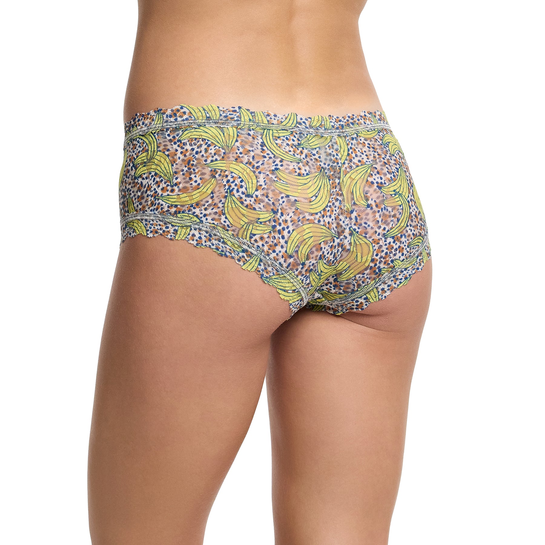 Hanky panky printed lace boyshort in pick me, yellow banana print on a brown and navy dot print background. Rear/side view on model.