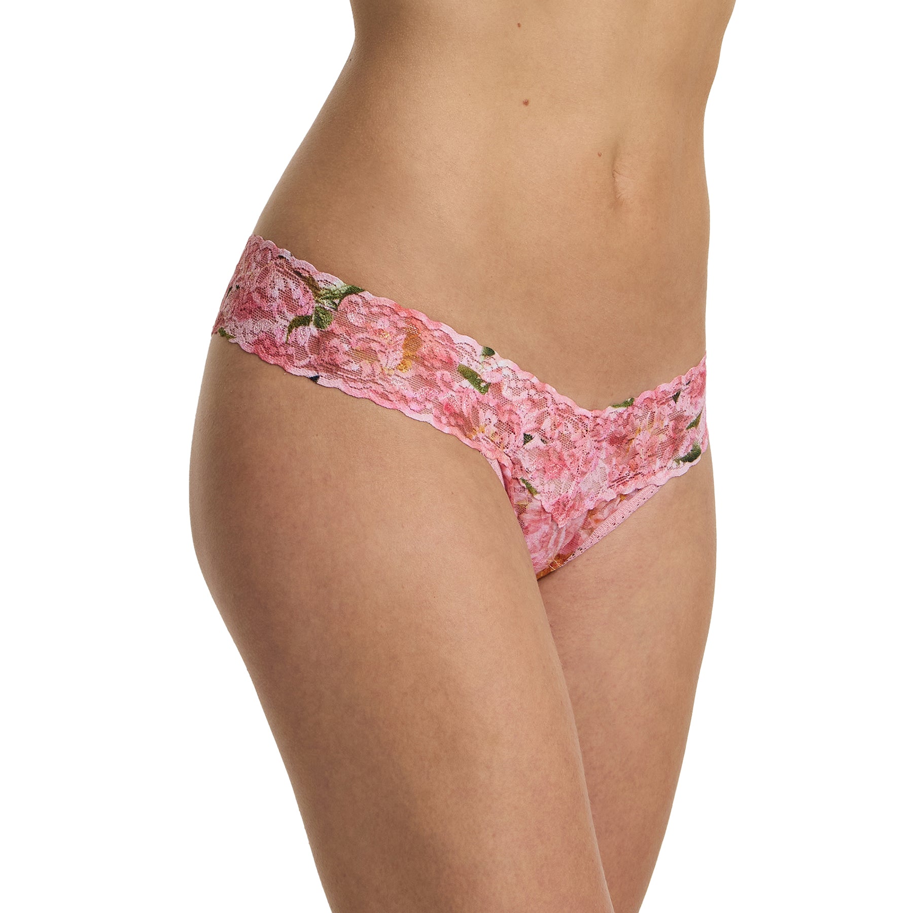 Side angle of model wearing pink floral lace low rise thong in the Dancing Petals print with soft stretch lace and scalloped edges