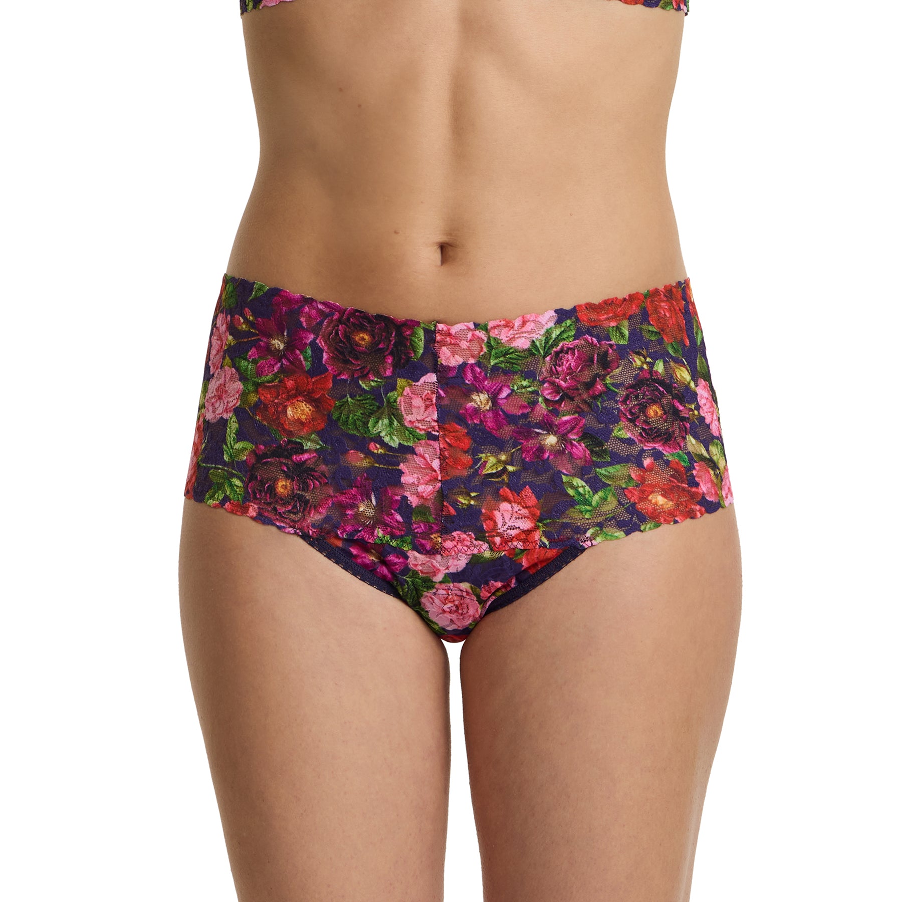Hanky panky retro printed thong PR9K1926 in WTAN winter's tale. A navy background with pink and red florals. Front view on model.