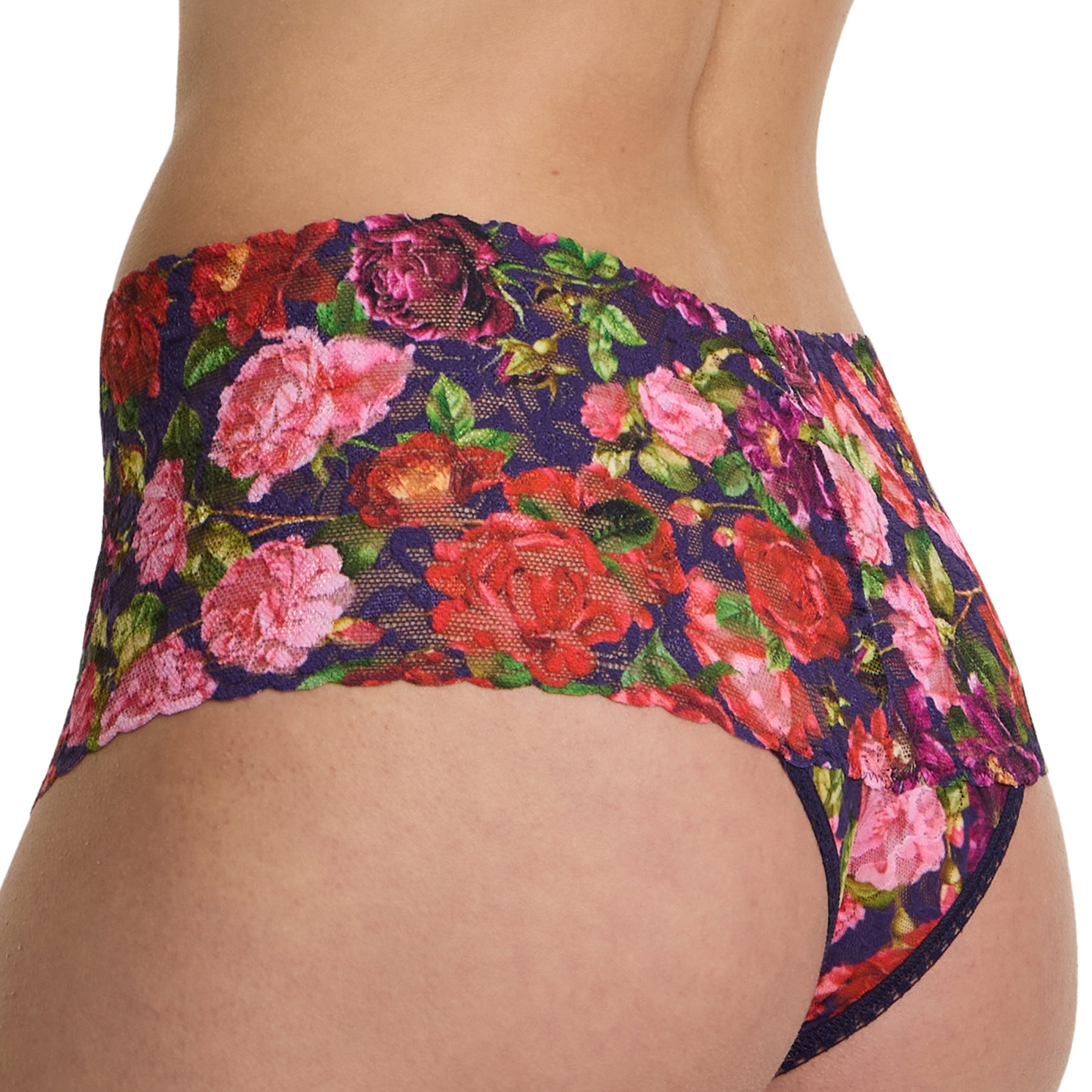 Hanky panky retro printed thong PR9K1926 in WTAN winter's tale. A navy background with pink and red florals. Rear close up view on model.