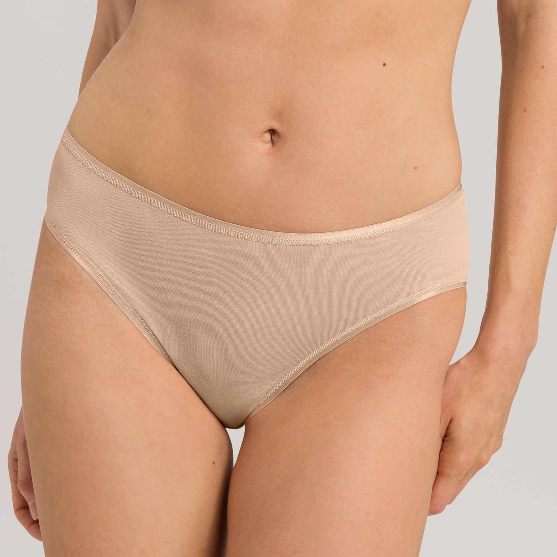 Front view of Hanro Cotton Seamless Bikini Panty in Beige with classic bikini cut and second-skin feel.