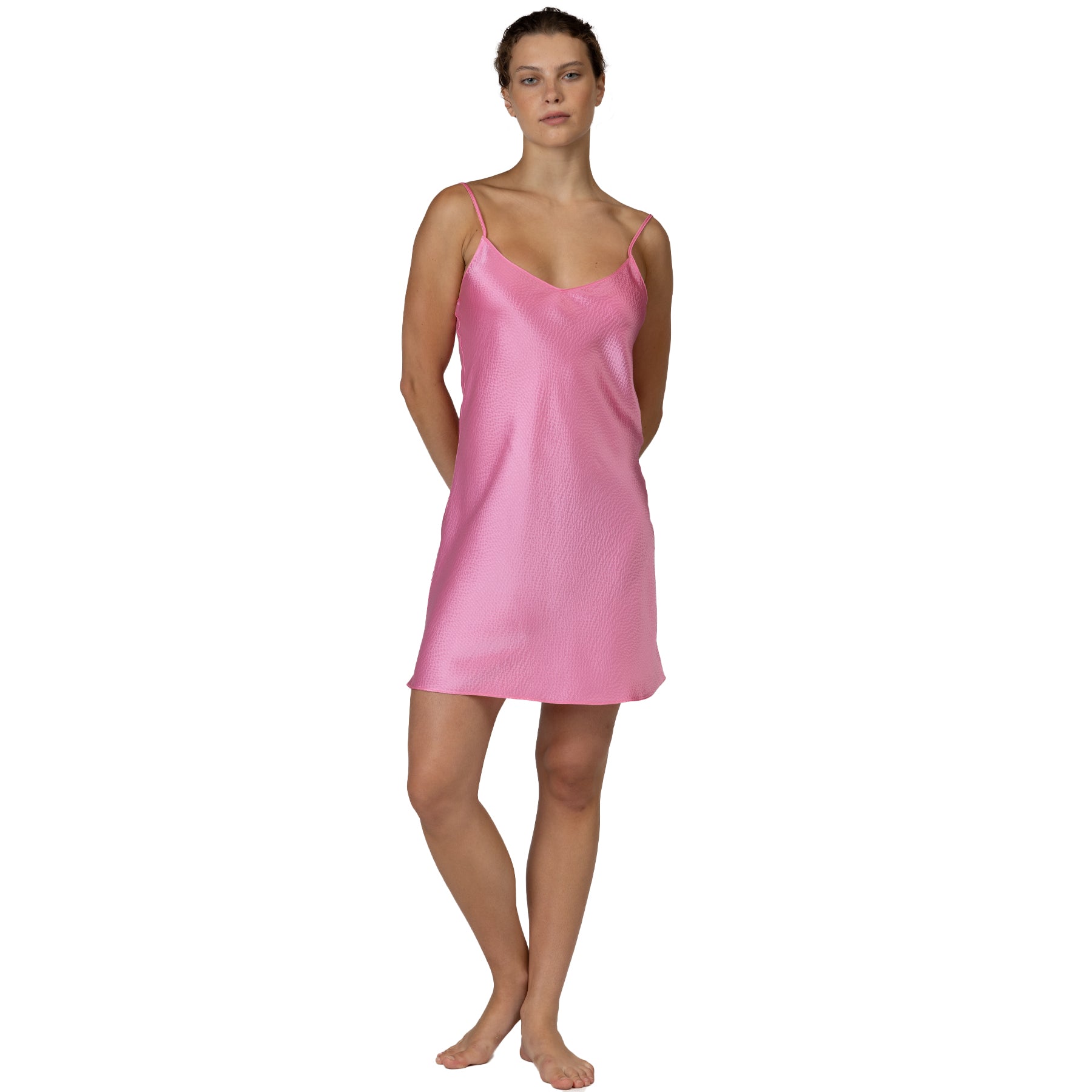 Pink satin slip dress front view with V-neckline and lightweight, fluid fit