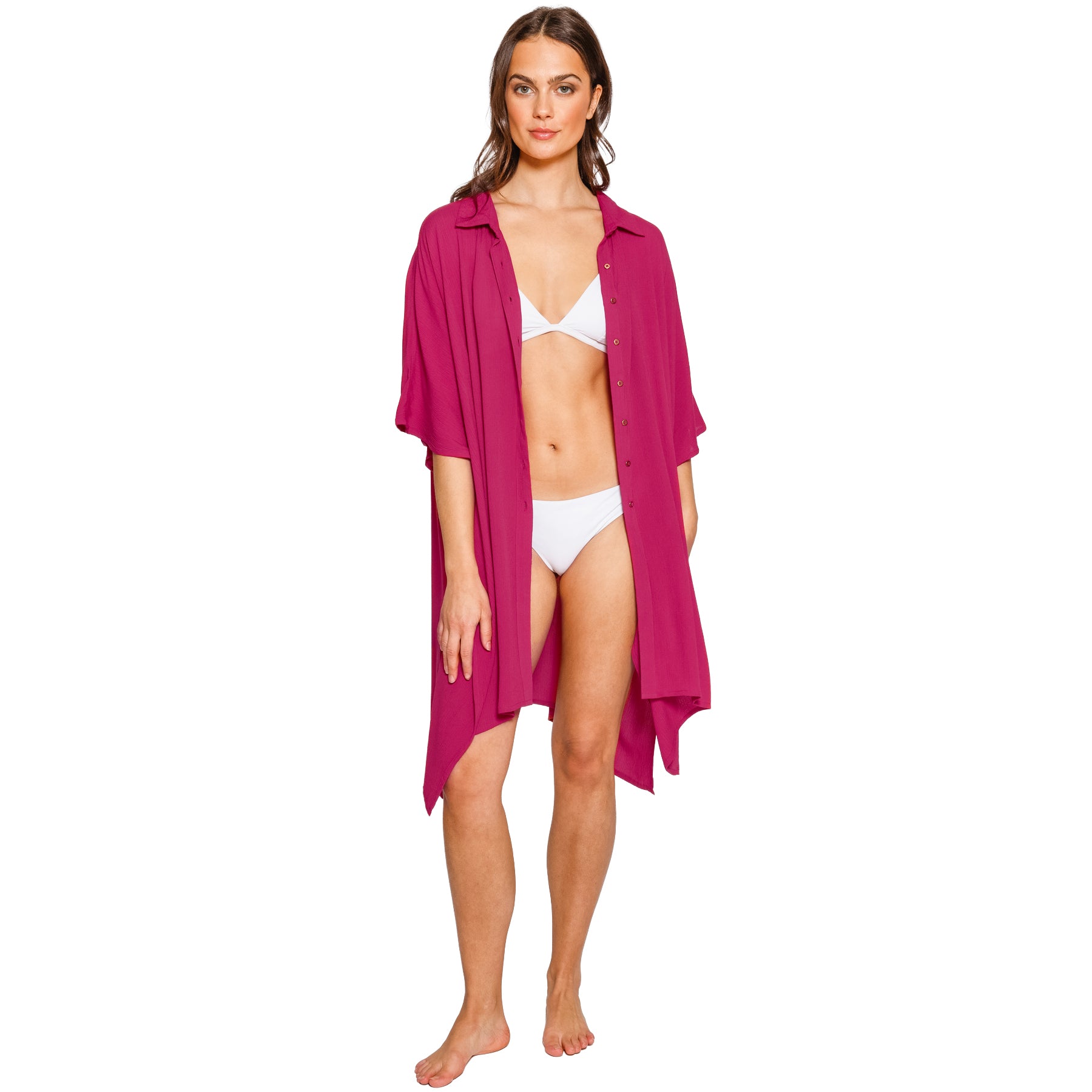Sangria pink beach cover-up featuring a button-front design, relaxed silhouette, and flowing asymmetrical hem worn over a bikini