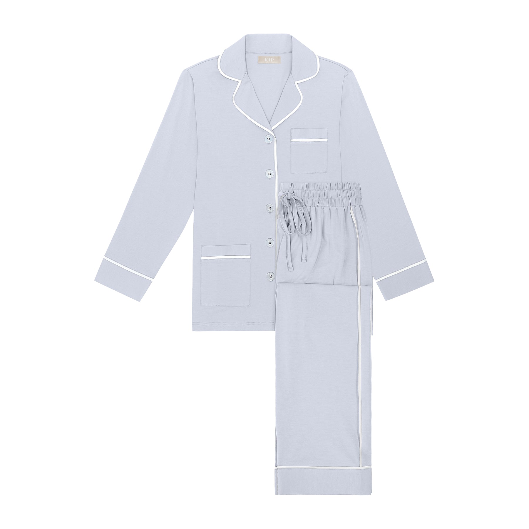 Classic cotton button up pyjama set in baby blue with contrast white piping. Front view without model.