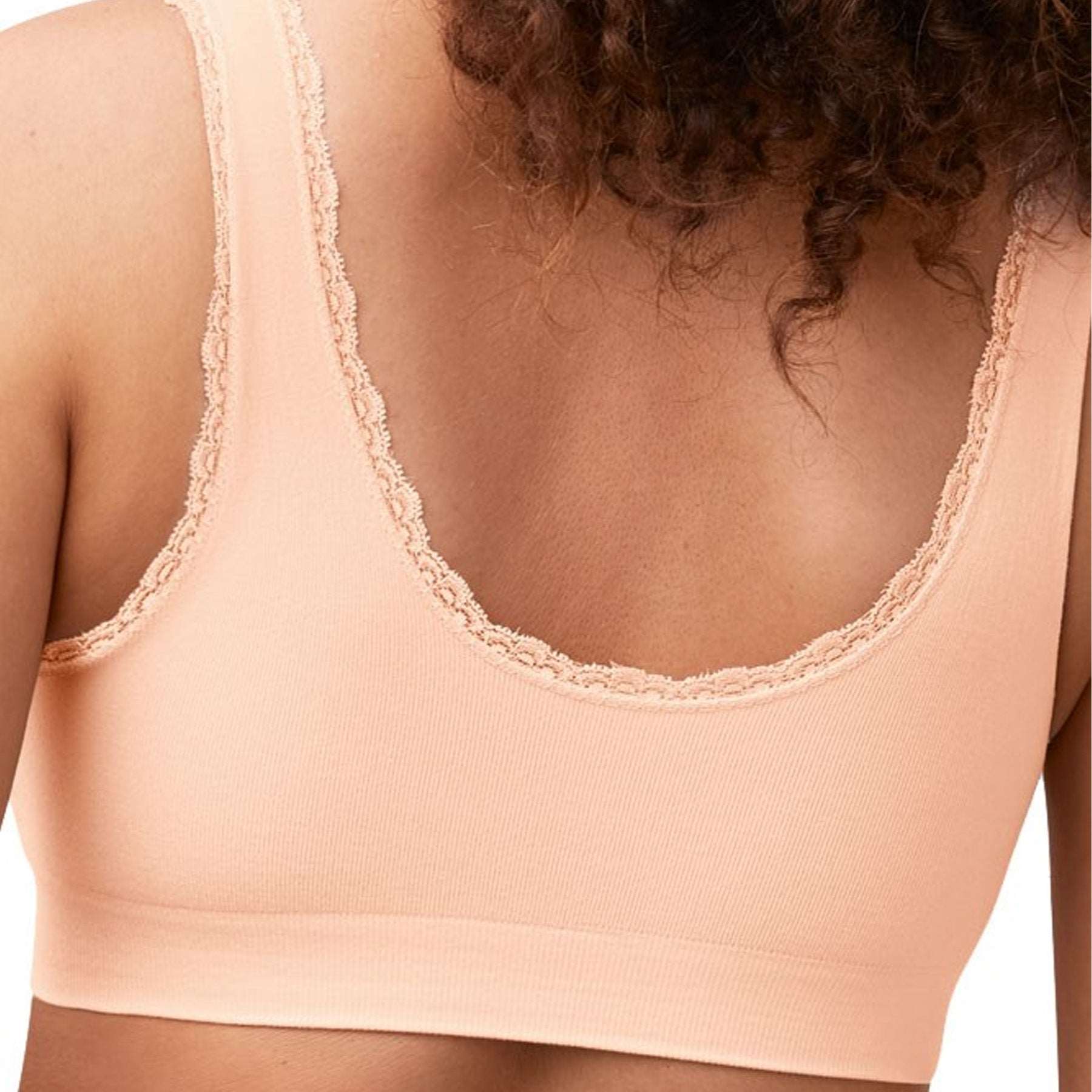 Amoena Kitty Wireless and seamless Bra in peachy pink on model rear view
