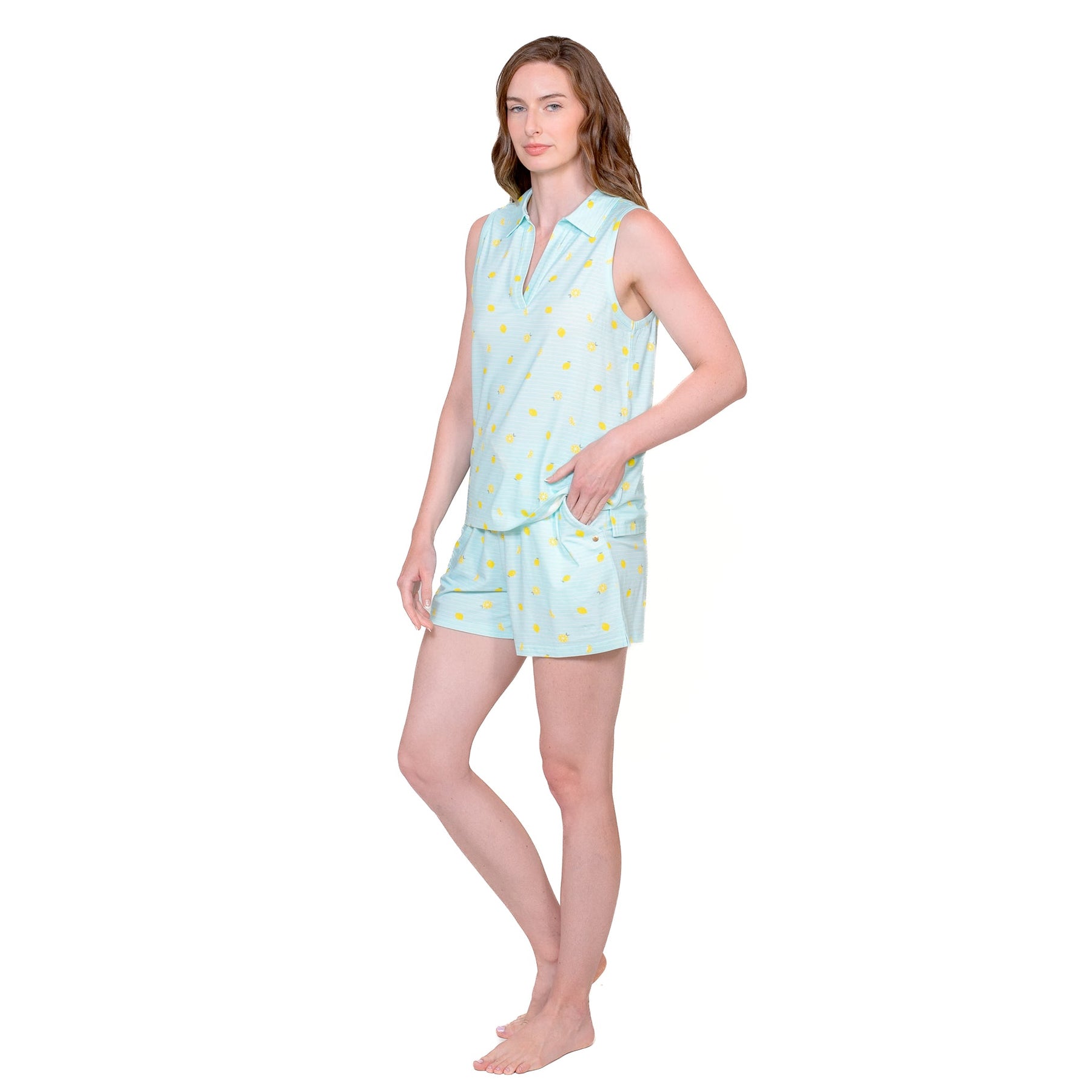 Side view of model in aqua blue PJ short set with yellow lemon print and pockets.